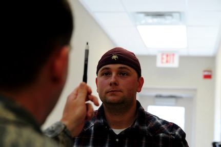 A student administers the Horizontal Gaze Nystagmus test to Corey Harvey during the standardized field sobriety testing course at Joint Base Charleston – Air Base, Jan. 23-26.  628th Security Forces Squadron personnel participated in the four day course which is designed to train and certify law enforcement officials in the use of driving under the influence detection techniques and national standardized field sobriety tests. Harvey is a law enforcement officer with the 628th SFS. (U.S. Air Force photo/ Staff Sgt. Nicole Mickle)  