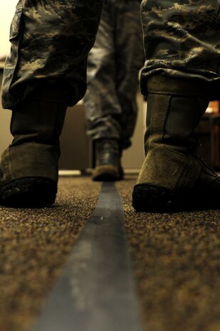 Students practice the walk and turn test during the Standardized Field Sobriety testing course at Joint Base Charleston - Air Base, Jan. 23-26.  628th Security Forces Squadron personnel participated in the four day course which is designed to train and certify law enforcement officials in the use of driving under the influence detection techniques and national standardized field sobriety tests.  (U.S. Air Force photo/ Staff Sgt. Nicole Mickle)  
