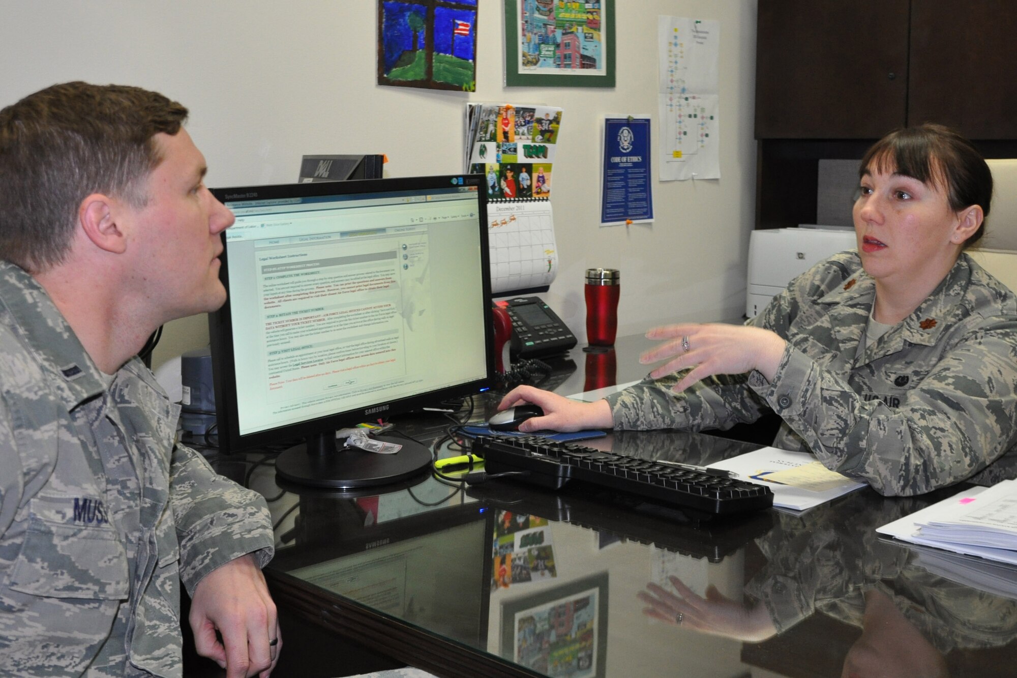Air Force Maj. Vicki A. Belleau (right), a Staff Judge Advocate assigned to the
910th Airlift Wing, shows the Air Force Legal Assistance website to 1st Lt.
Jeffrey G. Mussman, an Individual Mobilization Augmentee assistant judge
advocate, at her office here, Jan. 31, 2012. The 910th Staff Judge Advocate  serves both YARS and the 911th Airlift Wing at Pittsburgh IAP Air Reserve
Station, Pa. providing legal advice regarding environmental, labor and
employment and contract law.    The office also provides various other legal
advice and assistance in coordination with the 910th Judge Advocate General
office. The site they are viewing, https://aflegalassistance.law.af.mil, is intended for active duty, reserve component, retired military members, their family members, and others eligible for legal assistance through the Air Force.   
