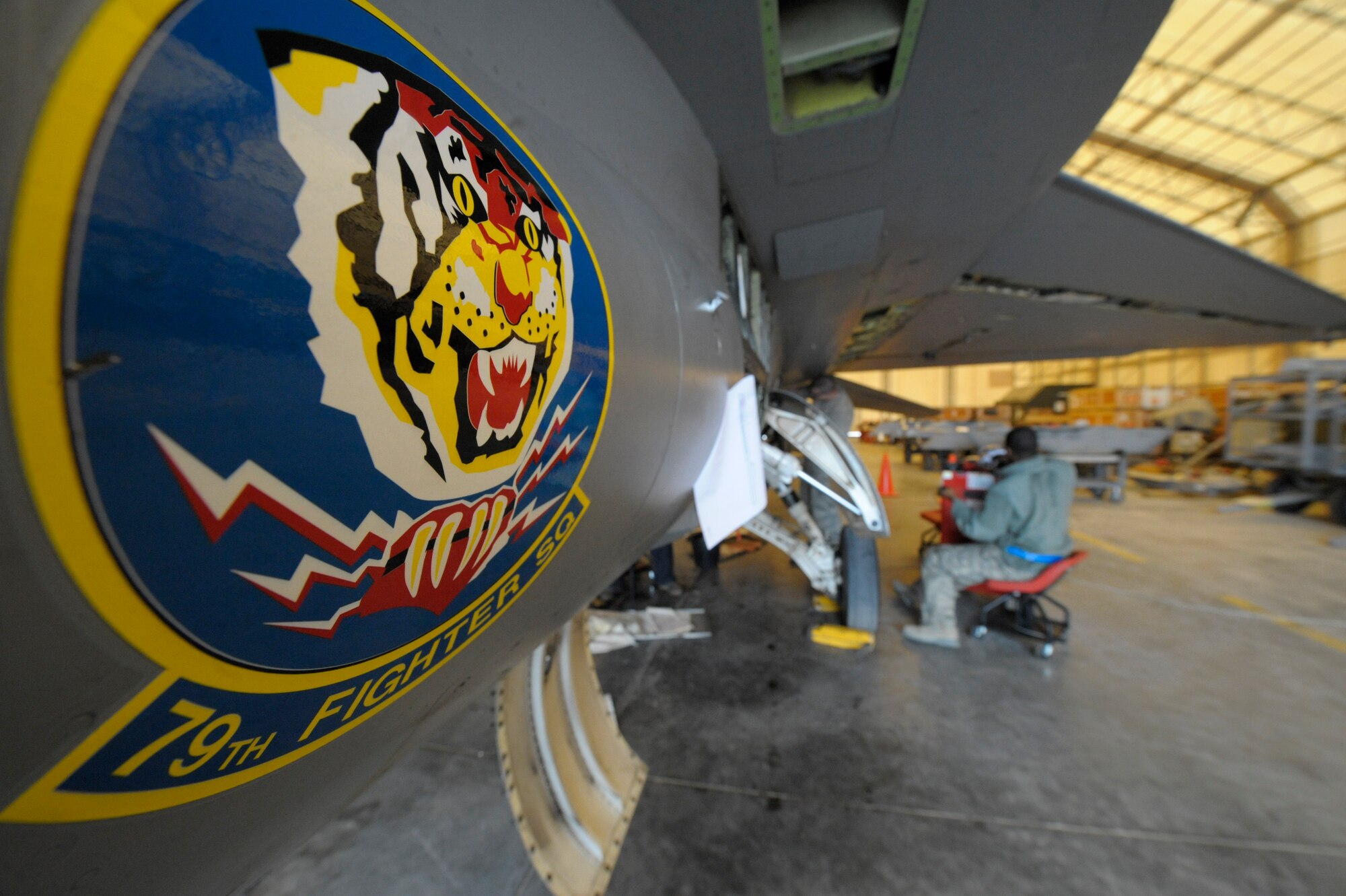 Members of the 332nd Expeditionary Maintenance Squadron, work on an F-16 Fighting Falcon during a phase inspection at an undisclosed location in Southwest Asia, Jan. 31, 2012. Aircraft go through phase every 400 flying hours to ensure they are in working order. The top to bottom inspection lasts up to 5 days. (U.S. Air Force photo by Staff Sgt. Joshua J. Garcia/Released)
