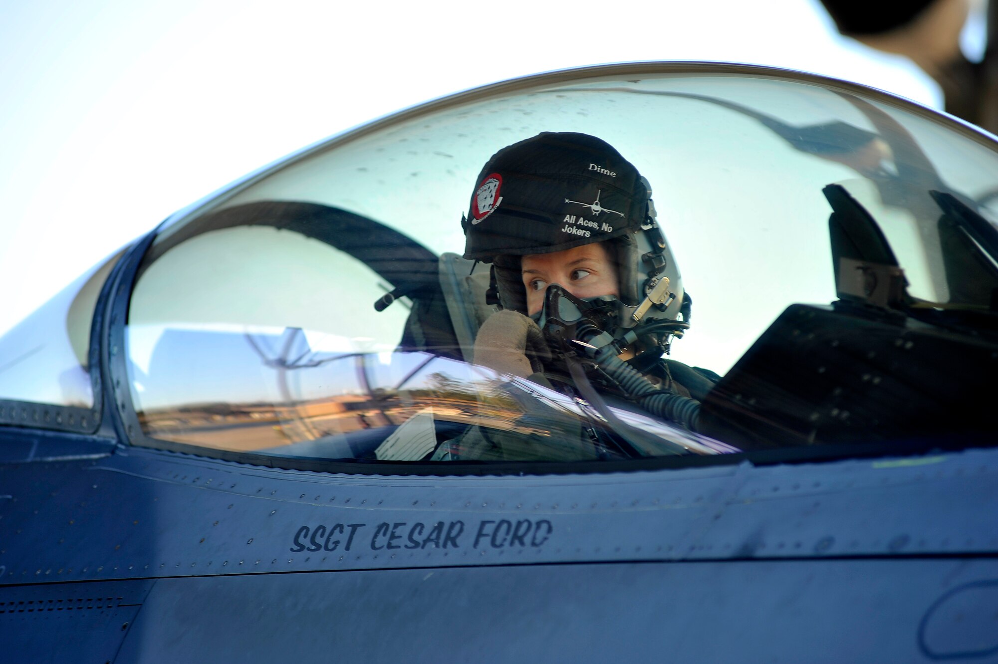 U.S. Air Force Capt. Betsy Hand, 77th Fighter Squadron F-16 Fighting Falcon pilot, talks with other F-16 pilots before launching during an Operational Readiness Exercise, Jan. 31, 2012, Shaw Air Force Base, S.C. The ORE evaluated the 20th Fighter Wing's ability to meet wartime and contingency tasks. During this particular exercise, 77th FS personnel prepped and launched several F-16s to challenge and enhance their wartime capabilities. (U.S. Air Force photo by Senior Airman Kenny Holston/Released)

