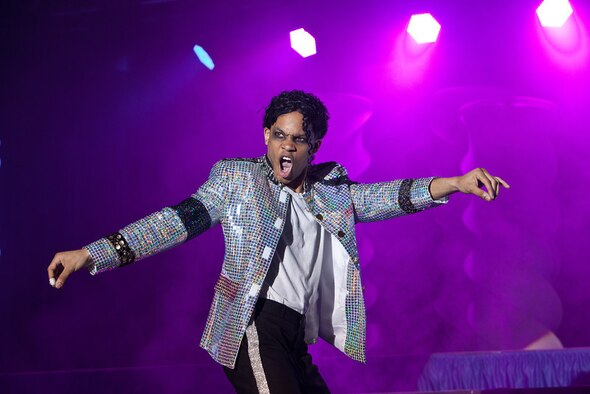 Staff Sgt. Tyron Jones from Yokota Air Base, Japan, thrills the audience while impersonating Michael Jackson during his specialty performance at the 2012 Air Force Worldwide Talent Search at Lackland Air Force Base, Texas, Jan. 15, 2012. Jones won best in show for the competition, which took place Jan. 9-16. The annual competition helps select members for the expeditionary entertainment group,Tops in Blue. (U.S. Air Force photo/Chris Burch)