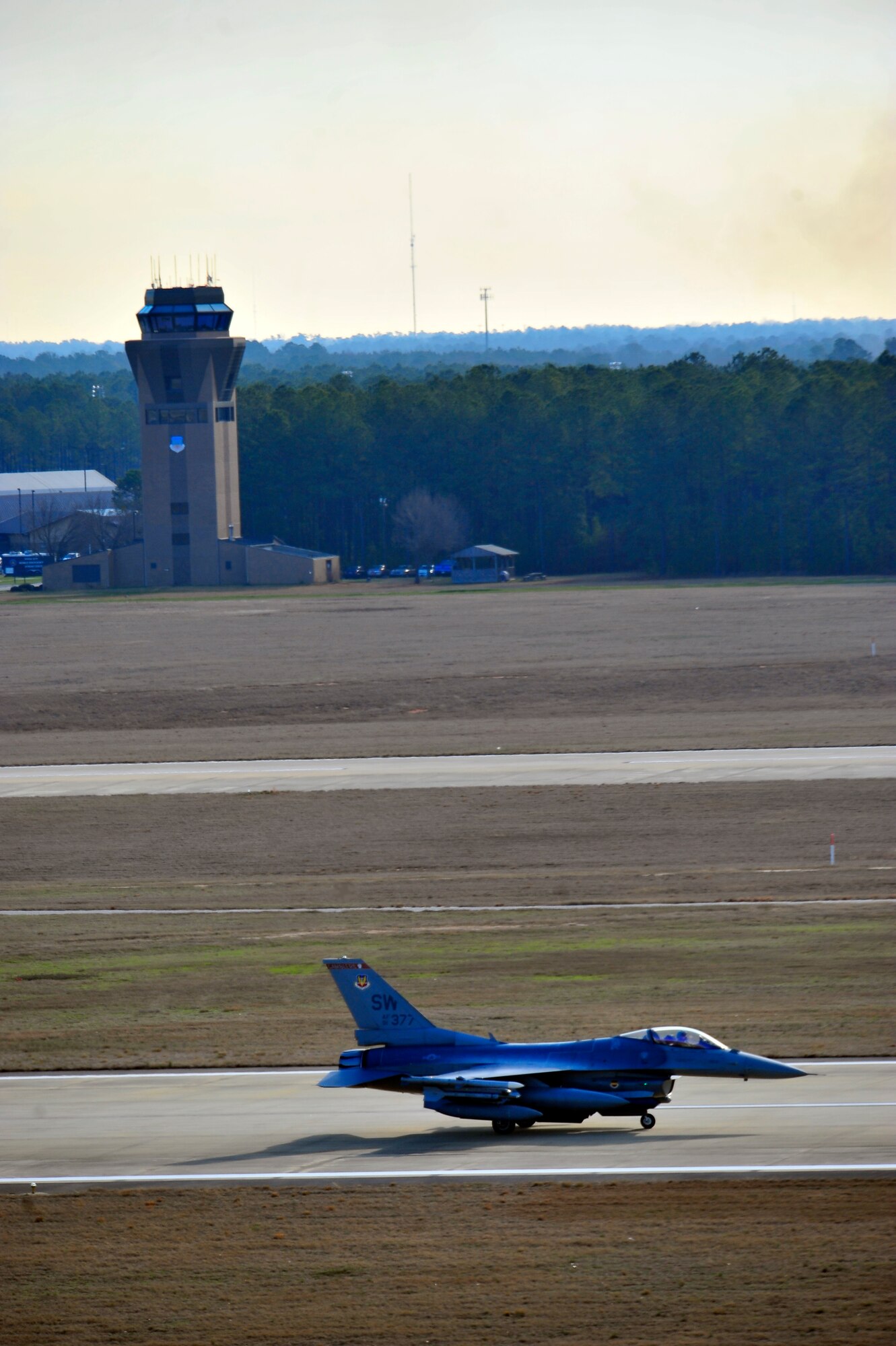 U.S. Air Force F-16 Fighting Falcon, passes the air control tower while taxiing down the flightline during an Operational Readiness Exercise at Shaw Air Force Base, S.C. Jan. 31, 2012. ORE’s train Shaw team members to be mission capable and prepare for deployments. (U.S. Air Force photo/Senior Airman Neil D. Warner/Released)