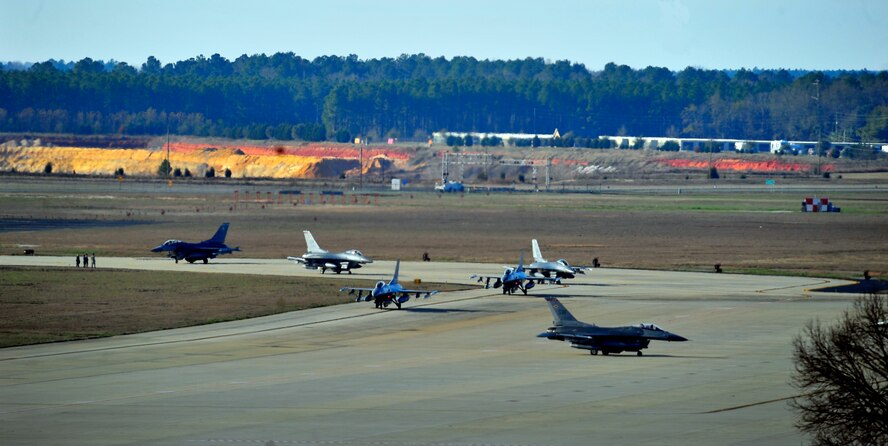 U.S. Air Force F-16 Fighting Falcon jets, began to taxi off of the flightline during an Operational Readiness Exercise at Shaw Air Force Base, S.C. Jan. 31, 2012. ORE’s train Shaw team members to be mission capable and prepare for deployments. (U.S. Air Force photo/Senior Airman Neil D. Warner/Released)
