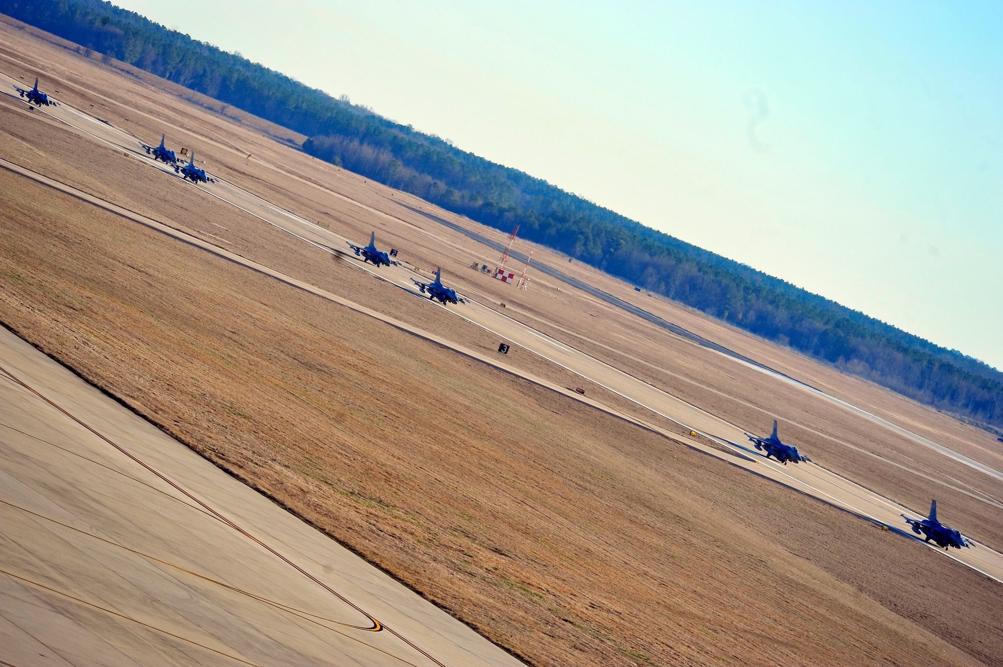U.S. Air Force F-16 Fighting Falcon jets, taxi down the flightline at Shaw Air Force Base, S.C. Jan. 31, 2012. ORE’s train Shaw team members to be mission capable and prepare for deployments. (U.S. Air Force photo/Senior Airman Neil D. Warner/Released)