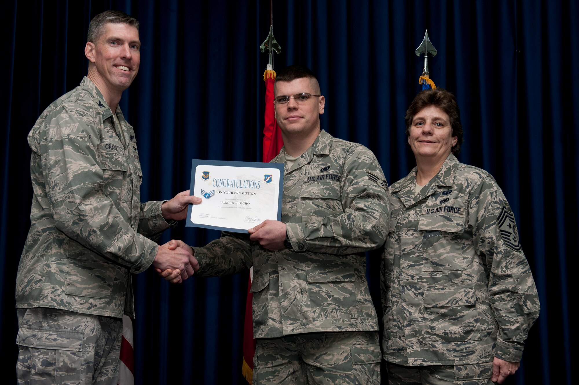 Robert Semcho, 39th Logistics Readiness Squadron, is promoted to the rank of senior airman Jan. 31, 2012, at the Club Complex ballroom at Incirlik Air Base, Turkey. (U.S. Air Force photo by Tech. Sgt. Michael B. Keller/Released)