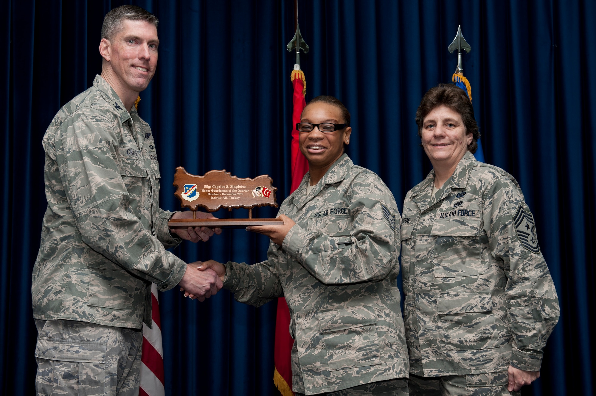 Staff Sgt. Caprice Singleton, 39th Logistics Readiness Squadron, receives the Honor Guardsman of the Quarter Award Jan. 31, 2012, at the Club Complex ballroom at Incirlik Air Base, Turkey. (U.S. Air Force photo by Tech. Sgt. Michael B. Keller/Released)