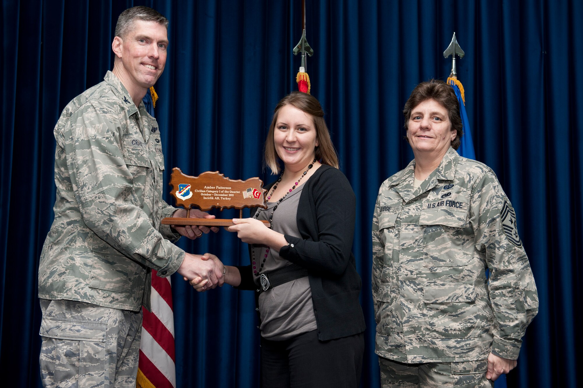 Amber Patterson, 39th Medical Group, receives the wing-level Civilian Category One of the Quarter Award Jan. 31, 2012, at the Club Complex ballroom at Incirlik Air Base, Turkey. (U.S. Air Force photo by Tech. Sgt. Michael B. Keller/Released)
