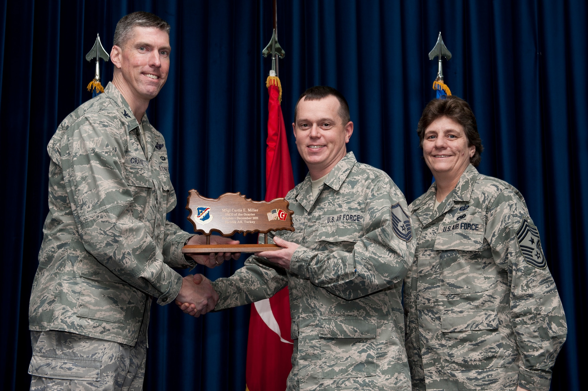 Master Sgt. Curtis Miller, 39th Medical Support Squadron, receives the wing-level Senior NCO of the Quarter Award Jan. 31, 2012, at the Club Complex ballroom at Incirlik Air Base, Turkey. (U.S. Air Force photo by Tech. Sgt. Michael B. Keller/Released)