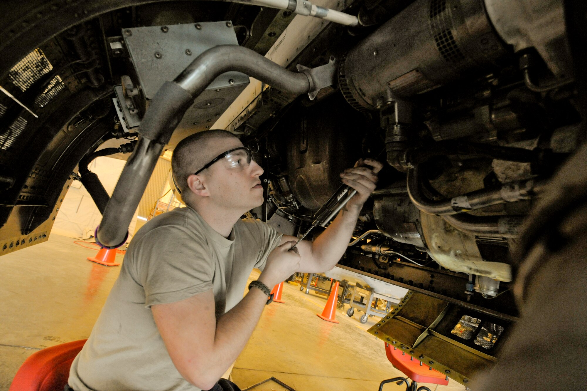 Senior Airman Tyler Barr, 332nd Expeditionary Maintenance Squadron crew chief, changes out an external constant speed drive filter on an F-16 Fighting Falcon during a phase inspection at an undisclosed location in Southwest Asia, Jan. 31, 2012. The constant speed drive provides main aircraft power by keeping the main generator turning at a constant speed. Barr is deployed from Shaw Air Force Base, S.C., and is a native of Urbana, Ohio. (U.S. Air Force photo by Staff Sgt. Joshua J. Garcia/Released) 