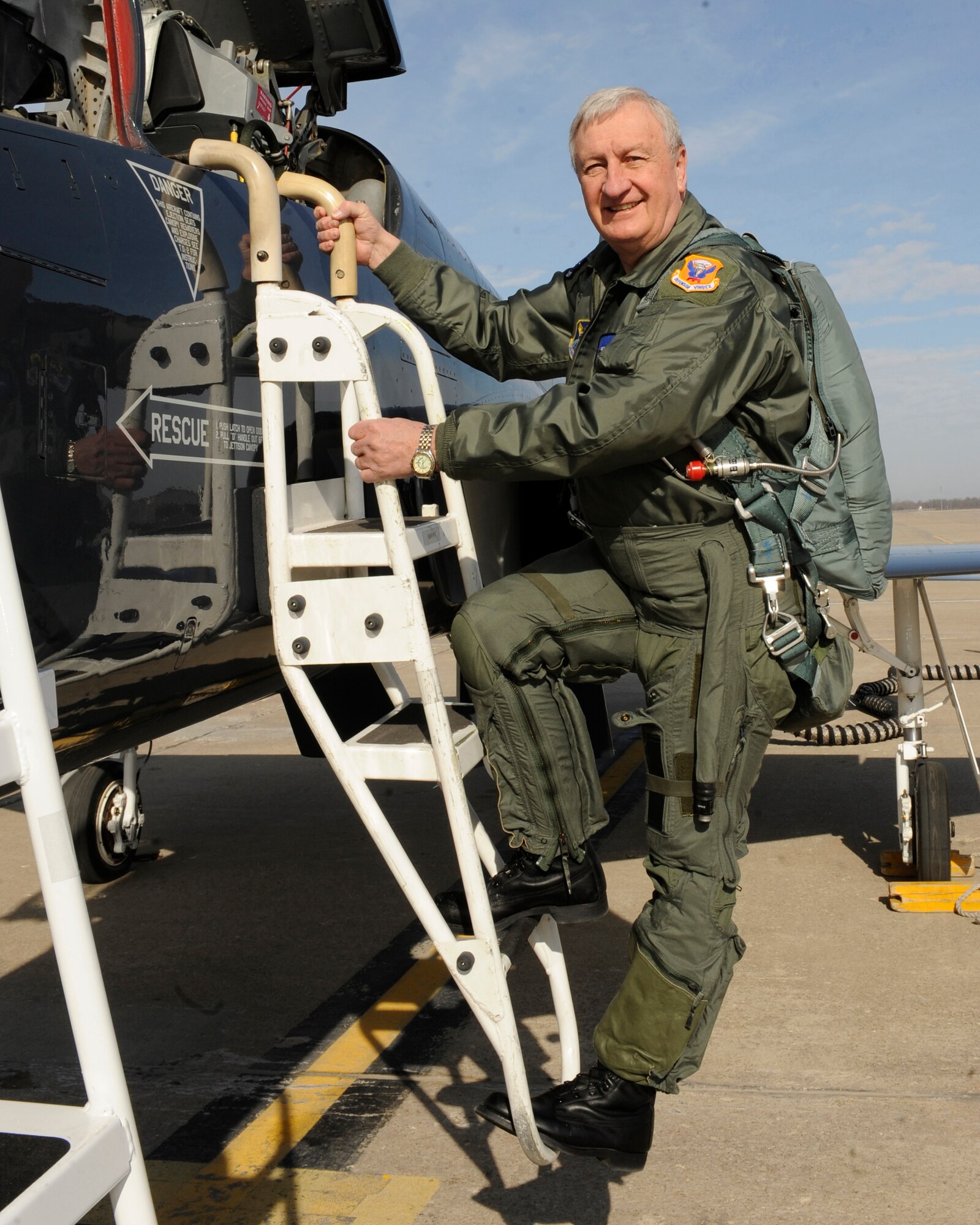 WHITEMAN AIR FORCE BASE, Mo. -- Joe Scallorns, a member of Air Force Global Strike Command's Civic Leader Program and board member of Whiteman Air Force Base's Base Community Council, climbs the ladder of a T-38 Talon assigned to Whiteman AFB before his incentive flight here Jan. 26. The purpose of the incentive flight was to give him a deeper understanding of the full spectrum of Air Force Global Strike Operations and a better understanding and appreciation for the quality Airmen and civilians who protect the nation every day.  (U.S. Air Force photo by Staff Sgt. Alexandra M. Boutte) (RELEASED)