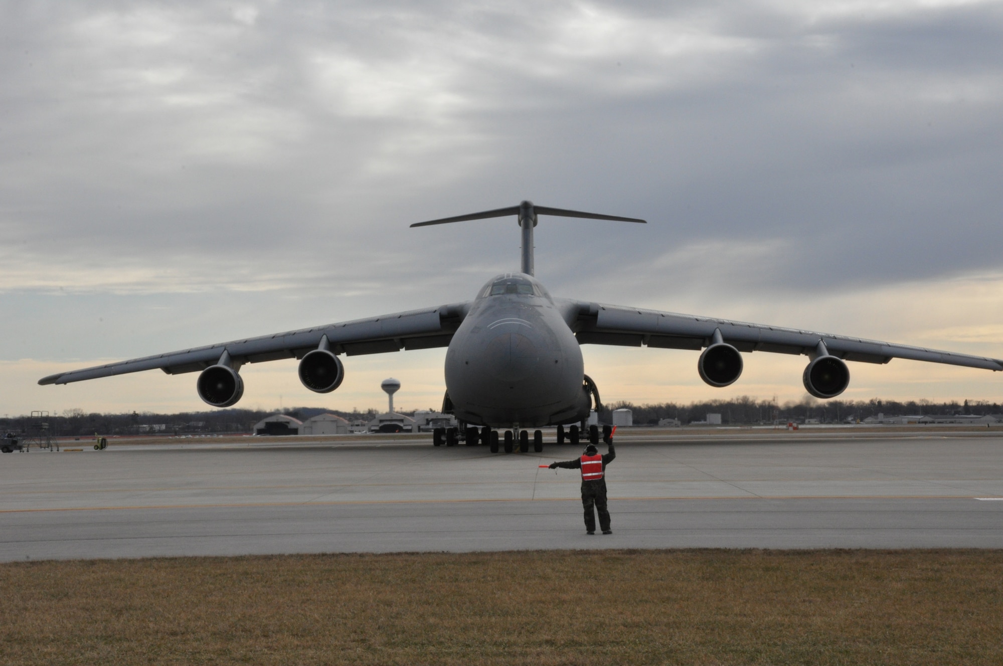 WRIGHT-PATTERSON AIR FORCE BASE, Ohio - The final 445th Airlift Wing C-5 Galaxy is marshaled out of its spot Jan. 31, 2012, in preparation for its final flight to Arizona where it will be stored at the 309th Aerospace Maintenance and Regeneration Group, also known as the “Boneyard” at Davis-Monthan Air Force Base, Tucson, Ariz. (U.S. Air Force photo/Tech. Sgt. Jeremy Caskey)