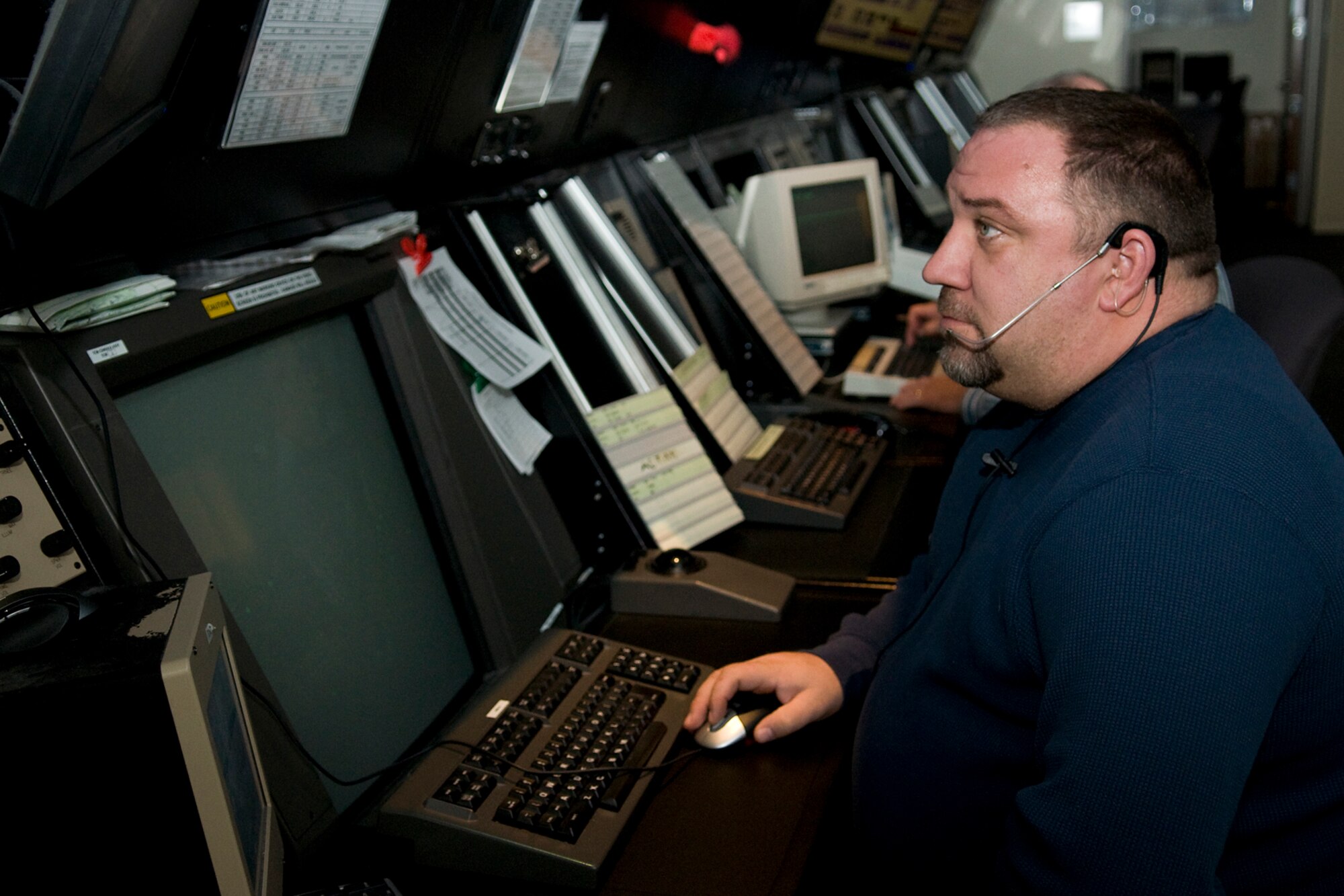 GRISSOM AIR RESERVE BASE, Ind. -- John Rhoutsong, an approach controller with the 434th Operations Support Squadron here, controls air traffic between Chicago and Indianapolis Jan. 20. Grissom air traffic controllers have been training hard to prepare for a blitz of Super Bowl air traffic since October 2011. (U.S. Air Force photo/Tech. Sgt. Mark R. W. Orders-Woempner) 
