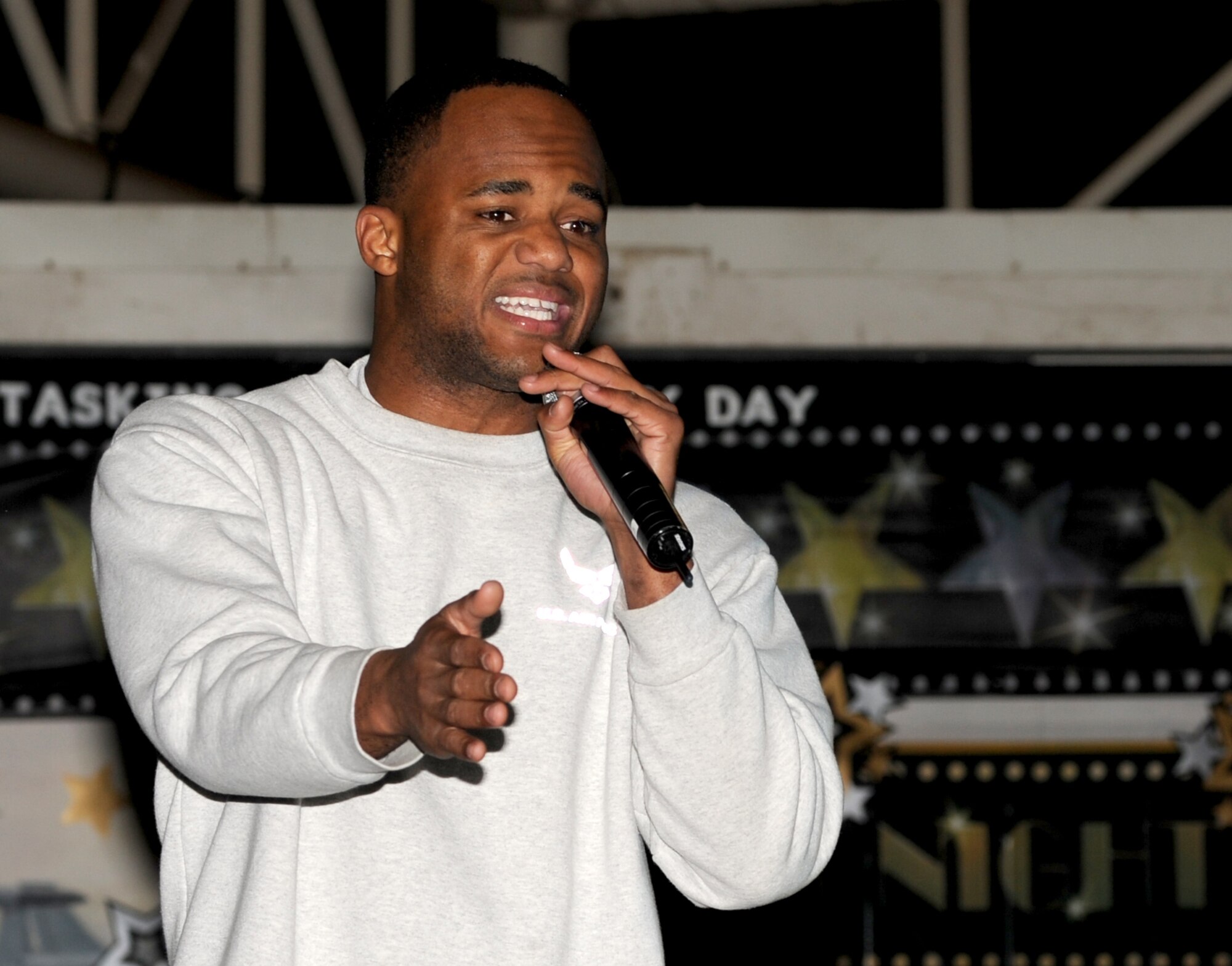SOUTHWEST ASIA - Senior Airman Walter Massey performs an original rap during a basewide talent competition at the 380th Air Expeditionary Wing Jan. 28 2012. Massey, a security forces specialist, separates from the Air Force this summer to pursue a career in music. He is deployed from Tinker Air Force Base, Okla. (U.S. Air Force photo/Tech. Sgt. Arian Nead) 
