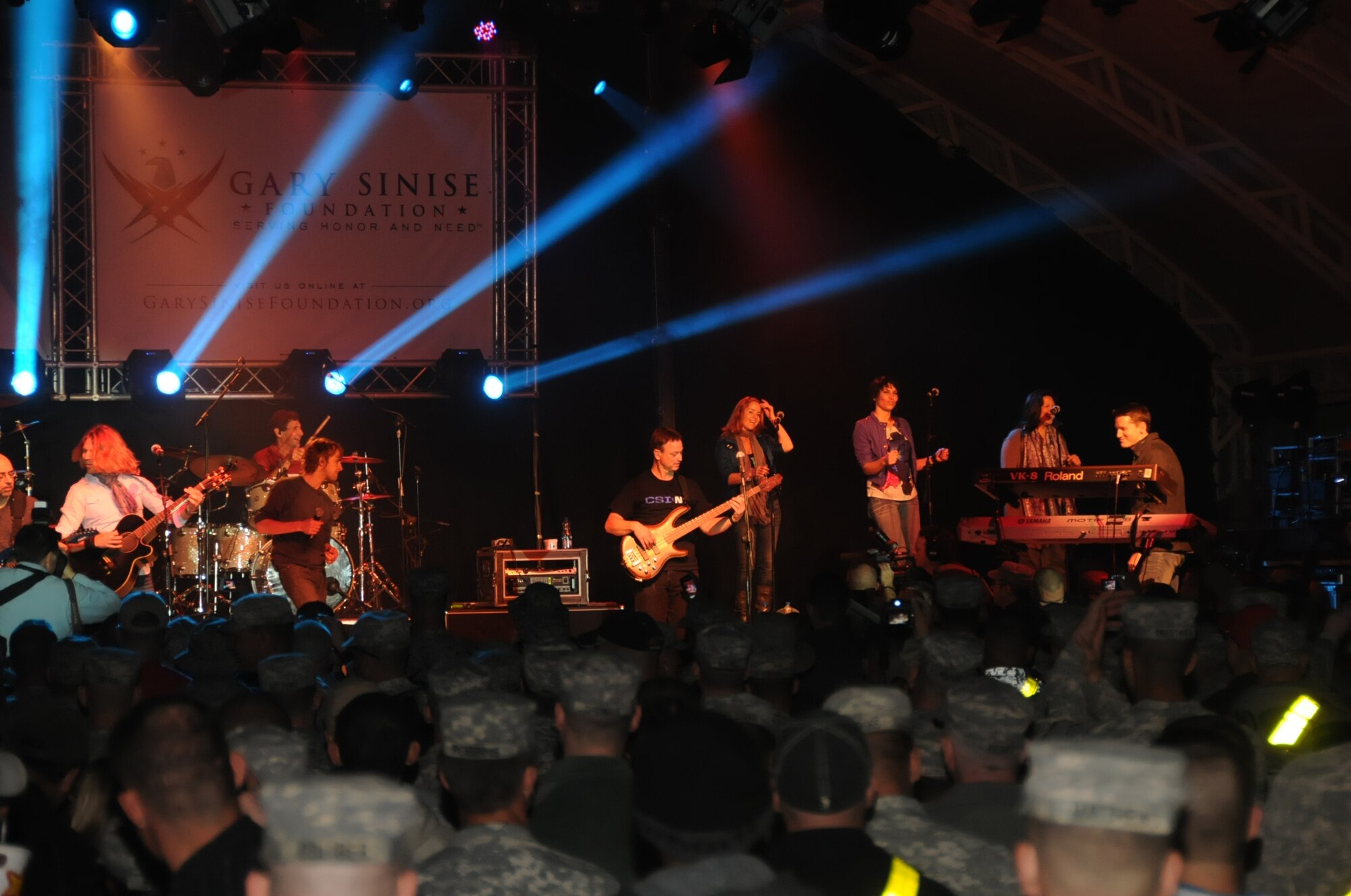 SOUTHWEST ASIA -- Emmy/Golden Globe Award-winning actor Gary Sinise and the Lt. Dan Band perform for troops in an undisclosed location in Southwest Asia on Jan. 28, 2012. Sinise and the Lt. Dan Band were formed by the Academy Award-nominated Sinise and Vietnam veteran Kimo Williams. The band has performed numerous shows across the world to support members of the U.S. military. (U.S. Air Force photo by Staff Sgt. James Lieth/Released)