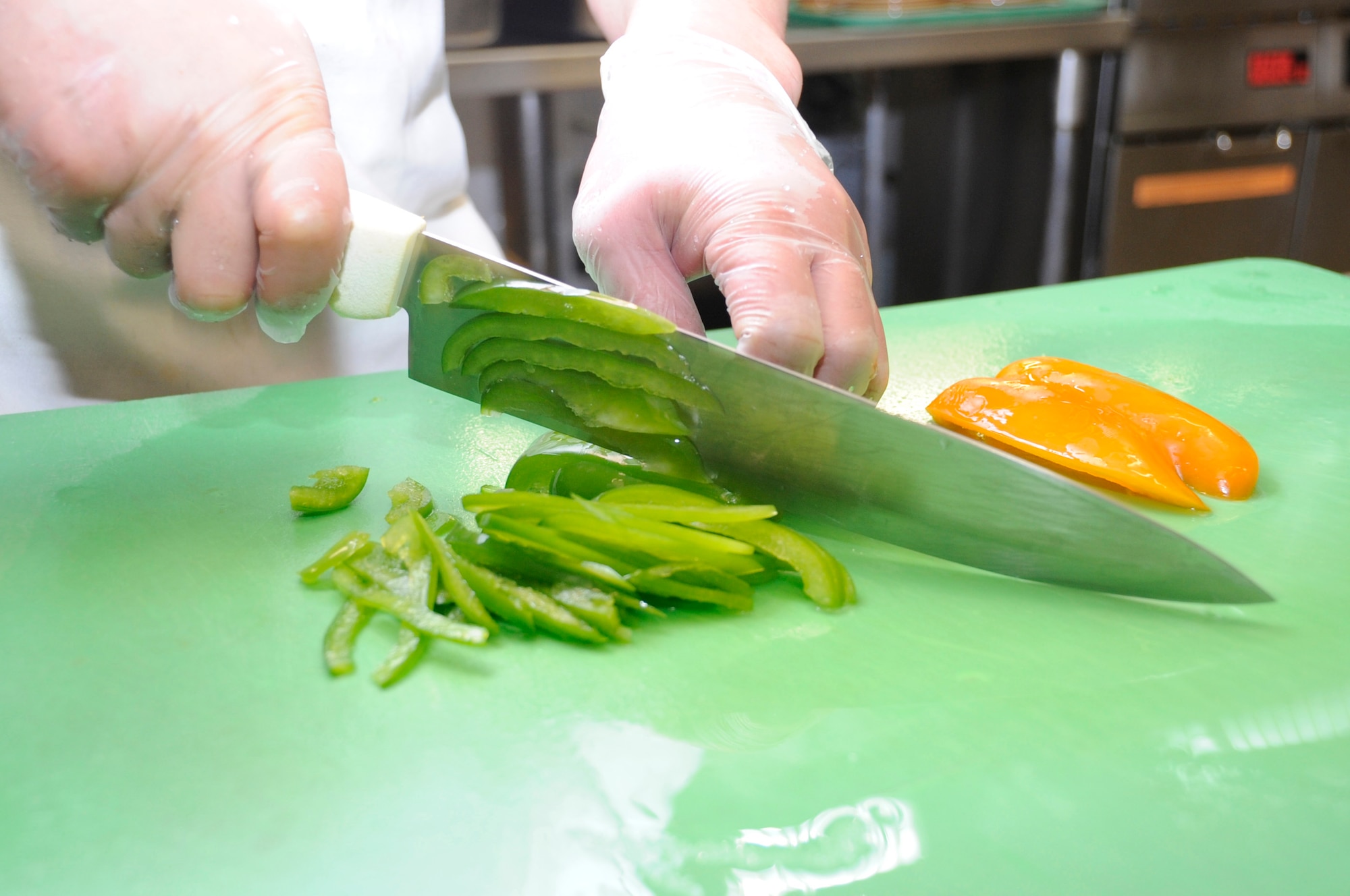MISAWA AIR BASE, Japan -- Satoru Numayama, 35th Force Support Squadron contract cook, chops vegetables at Grissom Dining Facility here, Jan. 26. Fresh ingredients are used at the DFAC to help ensure meals are healthy. (U.S. Air Force photo/Airman 1st Class Kaleb Snay)