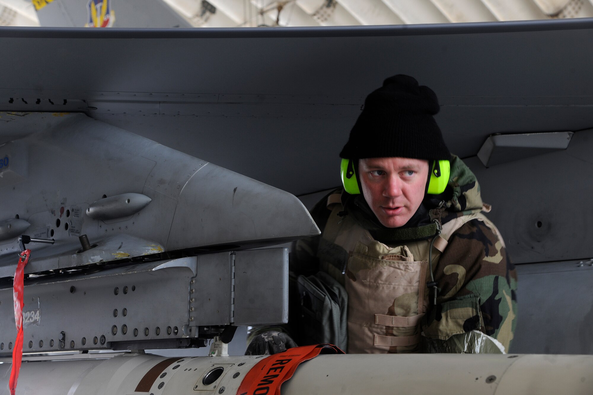 Staff Sgt. Jared Carroll, 20th Expeditionary Aircraft Maintenance Squadron weapons load crew member, ensures the air-to-ground missile (AGM - 88) is secured on an F-16 Fighting Falcon during a Peninsula Operational Readiness Exercise at Kunsan Air Base, Republic of Korea Jan 31, 2012. Carroll is deployed from Shaw Air Force Base, S.C. (U.S. Air Force photo by Staff Sgt. Rasheen A. Douglas/Released)