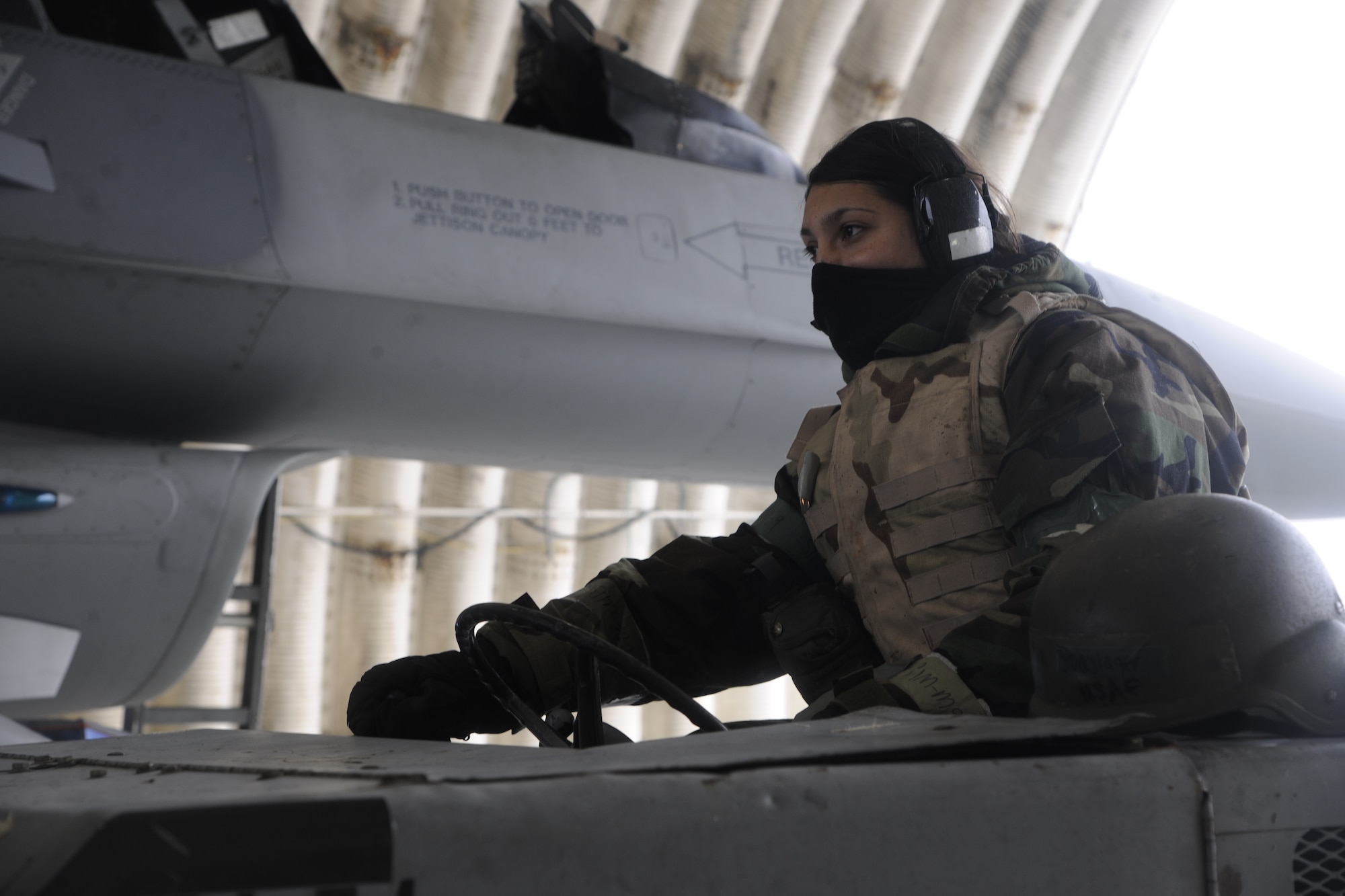 Senior Airman Eva Stockslager, 20th Expeditionary Aircraft Maintenance Squadron weapons load crew member, uses a MHU bomb lift truck to transport two air-to-ground missiles (AGM - 88) to load onto an F-16 Fighting Falcon during a Peninsula Operational Readiness Exercise at Kunsan Air Base, Republic of Korea Jan 31, 2012. PENOREs ensure Wolf Pack Airmen are capable of performing their duties in wartime conditions. Stockslager is deployed from to Korea Shaw Air Force Base, S.C. (U.S. Air Force photo by Staff Sgt. Rasheen A. Douglas/Released)