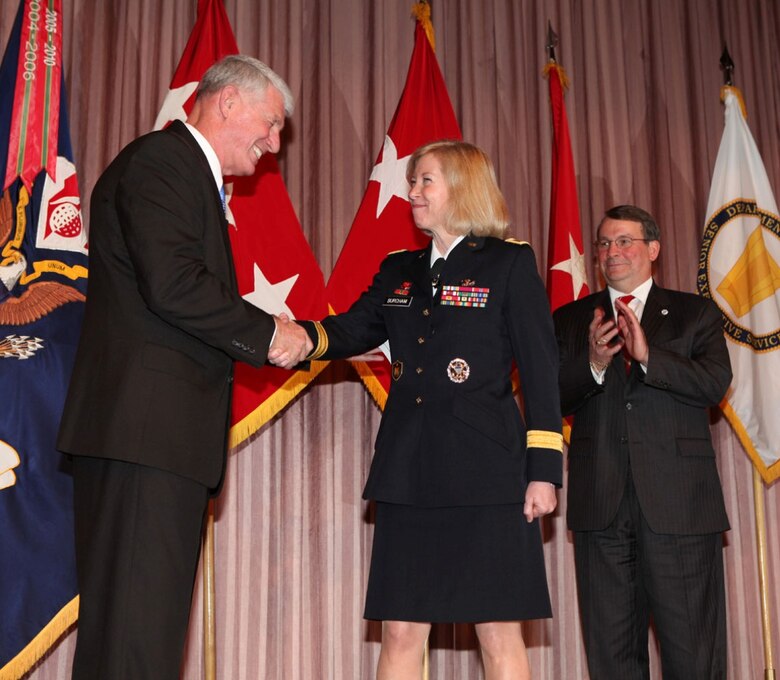 WASHINGTON — Lt. Gen. (ret.) Robert Van Antwerp, former U.S. Army Corps of Engineers chief of engineers, congratulates Brig. Gen. Margaret W. Burcham during her promotion ceremony at the headquarters here, Jan. 27, 2012. Burcham is the Army Corp of Engineers' first female general officer.  Last September, Burcham became the first woman selected to command a Corps of Engineers division when she took command of the Great Lakes and Ohio River Division located in Cincinnati, OH. The division consists of seven engineer districts that include over 4800 personnel operating in a 17 state region with the responsibility for the federal water resource development throughout the Great Lakes and Ohio River basins. 
