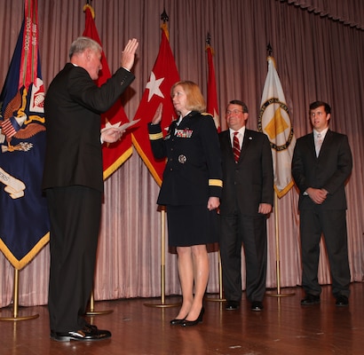 WASHINGTON — Lt. Gen. (ret.) Robert Van Antwerp, former U.S. Army Corps of Engineers chief of engineers, administers the oath of office to Brig. Gen. Margaret W. Burcham during her promotion ceremony at the headquarters here, Jan. 27, 2012.  Brig. Gen. Burcham is the Army Corp of Engineers' first female general officer. Last September, Burcham became the first woman selected to command a Corps of Engineers division when she took command of the Great Lakes and Ohio River Division located in Cincinnati, OH. The division consists of seven engineer districts that include over 4800 personnel operating in a 17 state region with the responsibility for the federal water resource development throughout the Great Lakes and Ohio River basins.