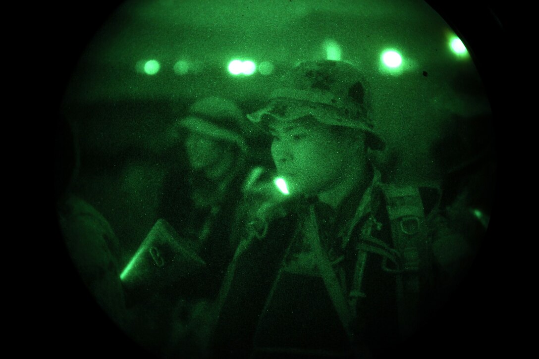 Two CH-46 Sea Knight helicopters prepare to take off for a night helocast training exercise at Camp Pendleton, Calif., Feb. 1. Marines from Company A, 1st Reconnaissance Battalion, 1st Marine Division,  helocasted with Japanese Rangers from the Japanese Ground Self Defense Force, as part of Exercise Iron Fist 2012, a bilateral training exercise between the 15th Marine Expeditionary Unit and the JGSDF.