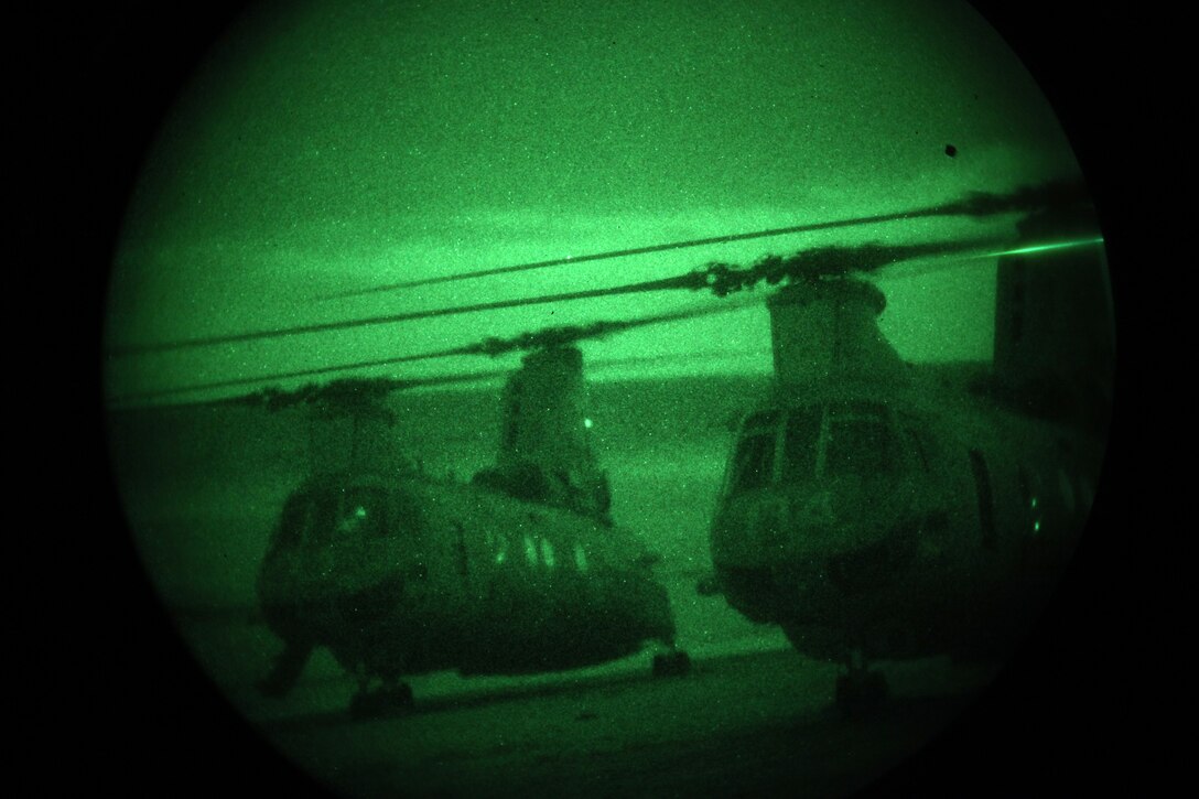 Two CH-46 Sea Knight helicopters prepare to take off for a night helocast training exercise at Camp Pendleton, Calif., Feb. 1. Marines from Company A, 1st Reconnaissance Battalion, 1st Marine Division,  helocasted with Japanese Rangers from the Japanese Ground Self Defense Force, as part of Exercise Iron Fist 2012, a bilateral training exercise between the 15th Marine Expeditionary Unit and the JGSDF.