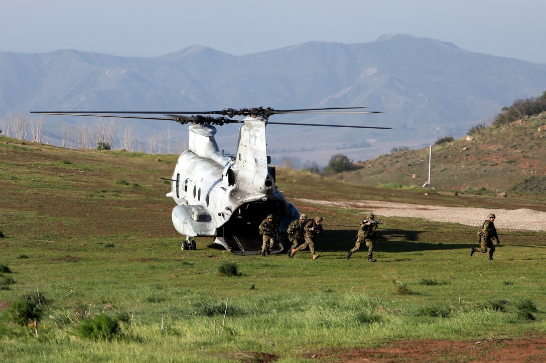 Soldiers from the Japanese Ground Self Defense Force run out from a CH-46 Sea Knight during a training exercise at Camp Pendleton, Calif., Feb. 1. The training event was part of Exercise Iron Fist 2012, a bilateral training exercise between the 15th Marine Expeditionary Unit and the JGSDF. The exercise encompassed all aspects of the Marine Air Ground Task Force during the amphibious landing on San Clemente Island provided the Navy/Marine Corps team an opportunity to practice their craft.