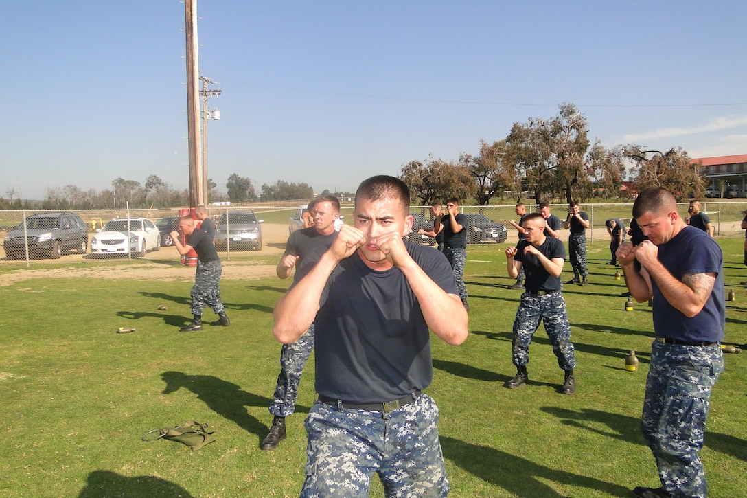 A Sailor displays the Basic Warrior Stance while participating in MCMAP (Marine Corps Martial Arts Program). Students endure long hours of training in MCMAP and will be qualified a Tan Belt before leaving Field Medical Training Battalion as an 8404 Hospital Corpsmen Marine Qualified.