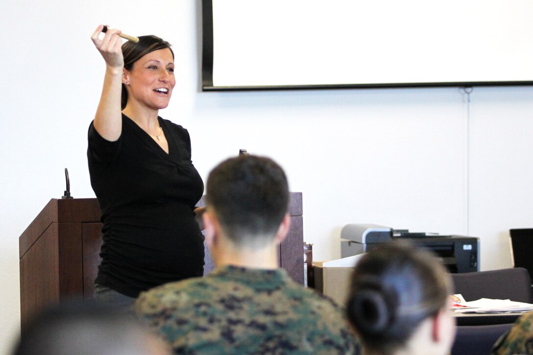 Michelle Gifford, health promoter with Semper Fit, shows viles of "fiber" to Marines attending the Nutrition 101 class at the Marine Corps Base Pendleton's Paige Fieldhouse.