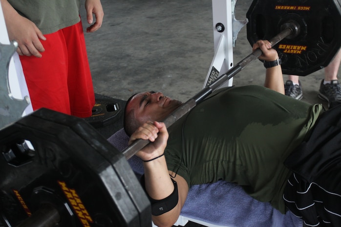 Cpl. Damian Renifo, a Marine Aircraft Logistics Squadron 12 maintenance administrator, lifts weights Feb. 2 at the full gym set up by Marine Corps Community Services during Exercise Cobra Gold 2012.