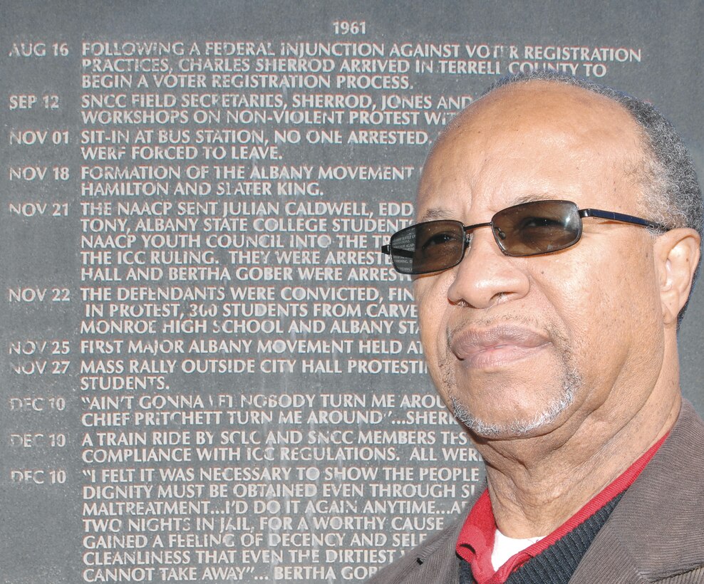 Charles M. Sherrod, a local civil rights activist, is pictured next to one of four monuments at the Civil Rights Park in Albany, Ga., bearing his name. The monuments chronicle the history of the Albany Movement.