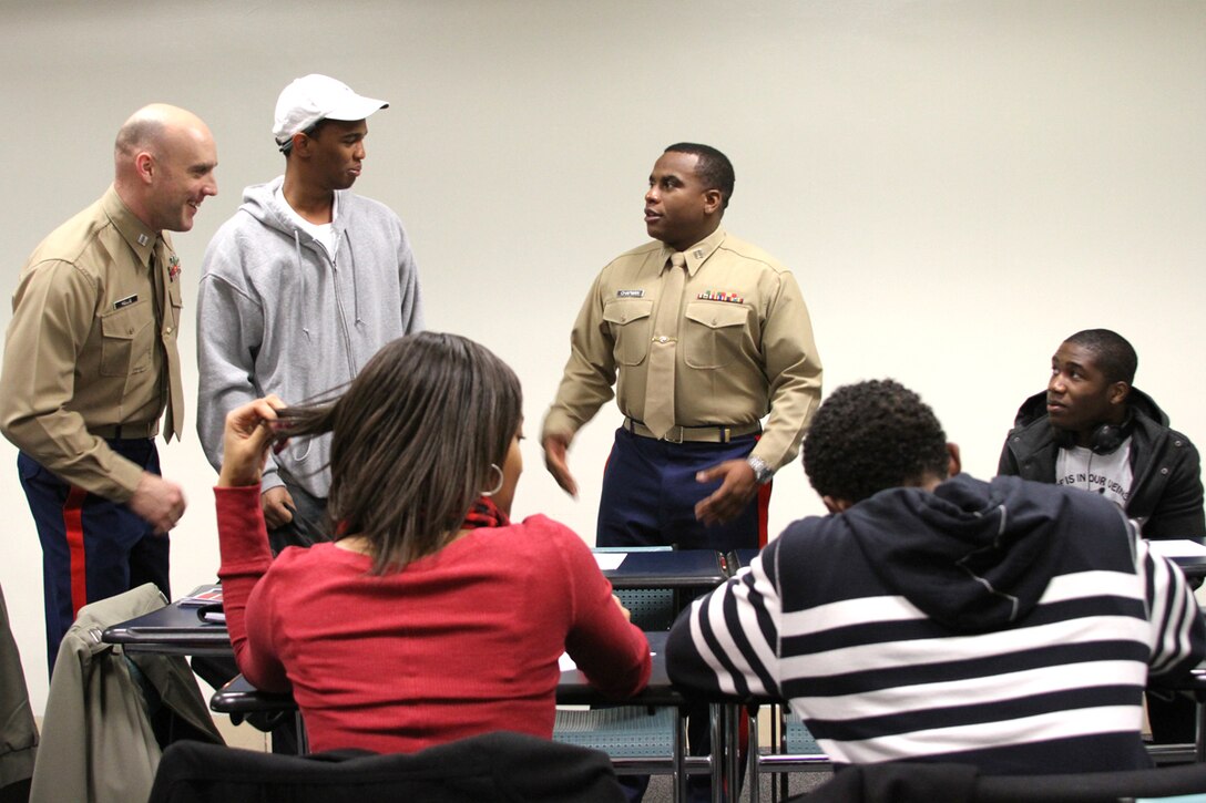 United States Marine Corps Capt. Maurice Chapman, a student at the Expeditionary Warfare School in Quantico, Va., and United States Marine Corps Capt. William Hollis, the officer selection officer for Recruiting Station Pittsburgh's Officer Selection Team State College, meet students at a leadership seminar Feb. 2, 2012 for the Penn State Chapter of the National Society of Black Engineers. The Marines covered the 14 Marine Corps leadership traits and spoke to the students about opportunities to serve in the military as a Marine Corps officer.