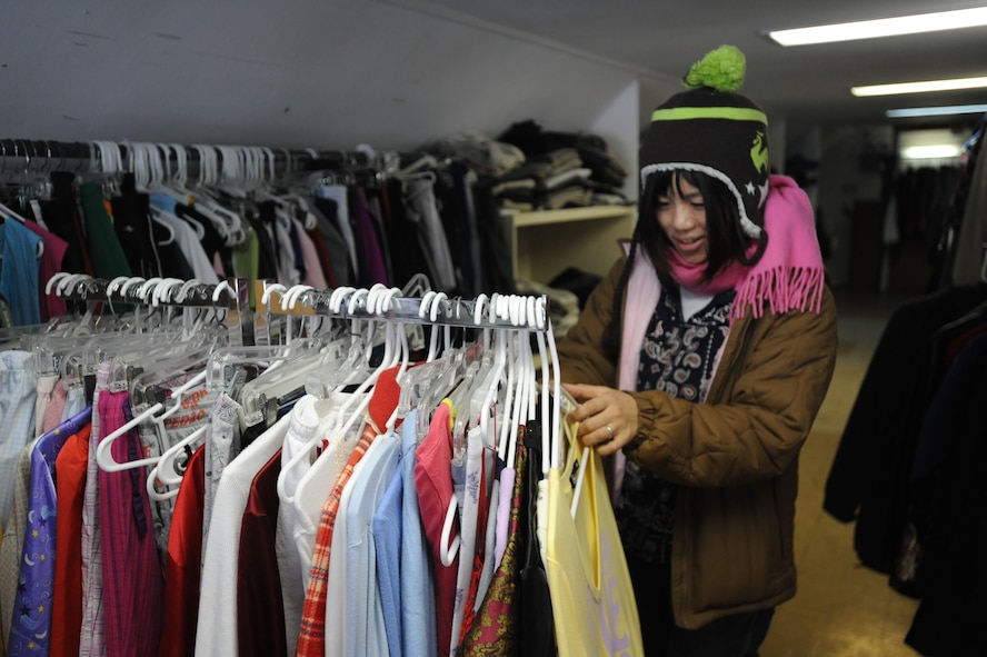 MISAWA AIR BASE, Japan – Maya Kato, a Japanese national, browses through a clothing rack at the base Thrift Shop here, Feb. 1. Kato lives off-base, but still enjoys purchasing items at the base Thrift Shop. The shop is now open on the first Saturday of every month from 9 a.m. to 1 p.m. (U.S. Air Force photo/Airman Kenna Jackson)