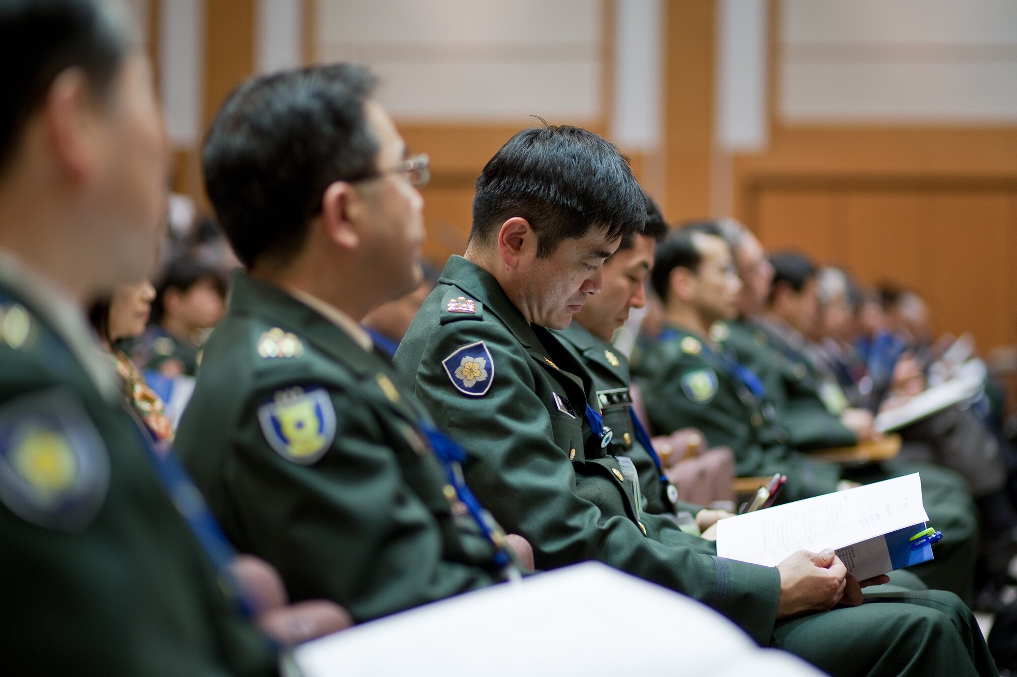 TOKYO, Japan -- Members of the Japan Ground Self-Defense Force listen to a briefing about Operation Tomodachi presented by Col. Lee Harvis, 374th Medical Group commander, and U.S. Forces, Japan and 5th Air Force surgeon, at the Japanese Ministry of Defense in Tokyo, Japan, Feb. 1, 2012. Six hundred members from the Japan Self-Defense Forces attended the Joint Defense Medical Seminar. Harvis gave a briefing on Yokota's medical response following the earthquake, tsunami, and Fukushima nuclear meltdown during Operation Tomodachi. (U.S. Air Force photo/Osakabe Yasuo)