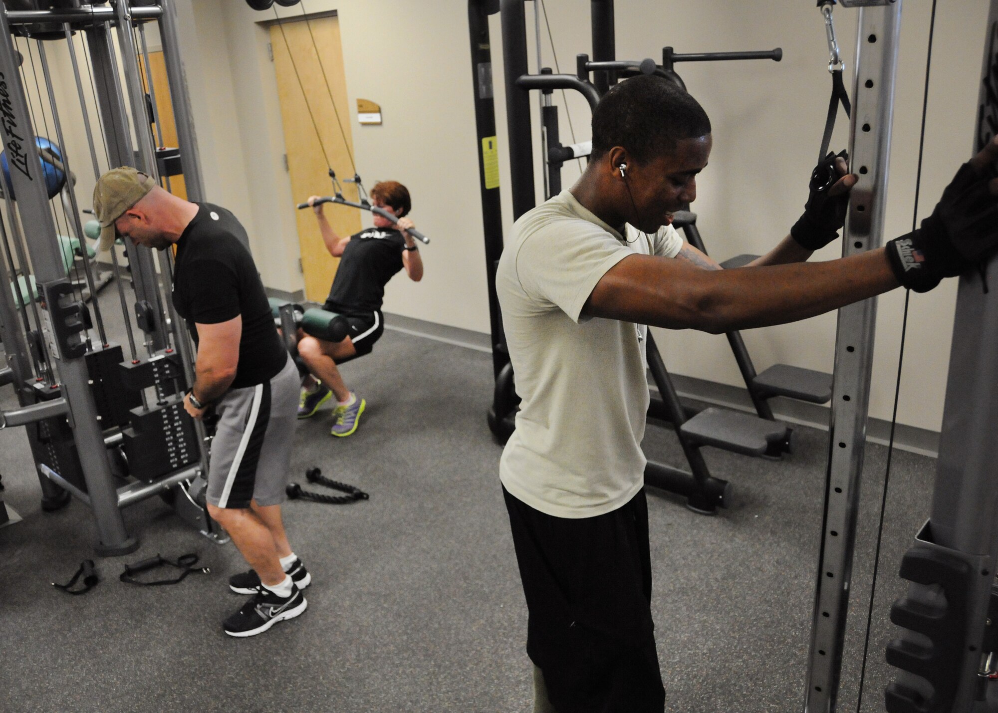 Members of the 919th Special Operations Wing work out in the weight room of the fitness center at Duke Field, Fla., recently. The newly renovated facility is officially open and available for use daily from 5 a.m. to 11 p.m. by members assigned to Duke Field and the 7th Special Forces Group. (U.S. Air Force photo/Tech. Sgt. Cheryl Foster)