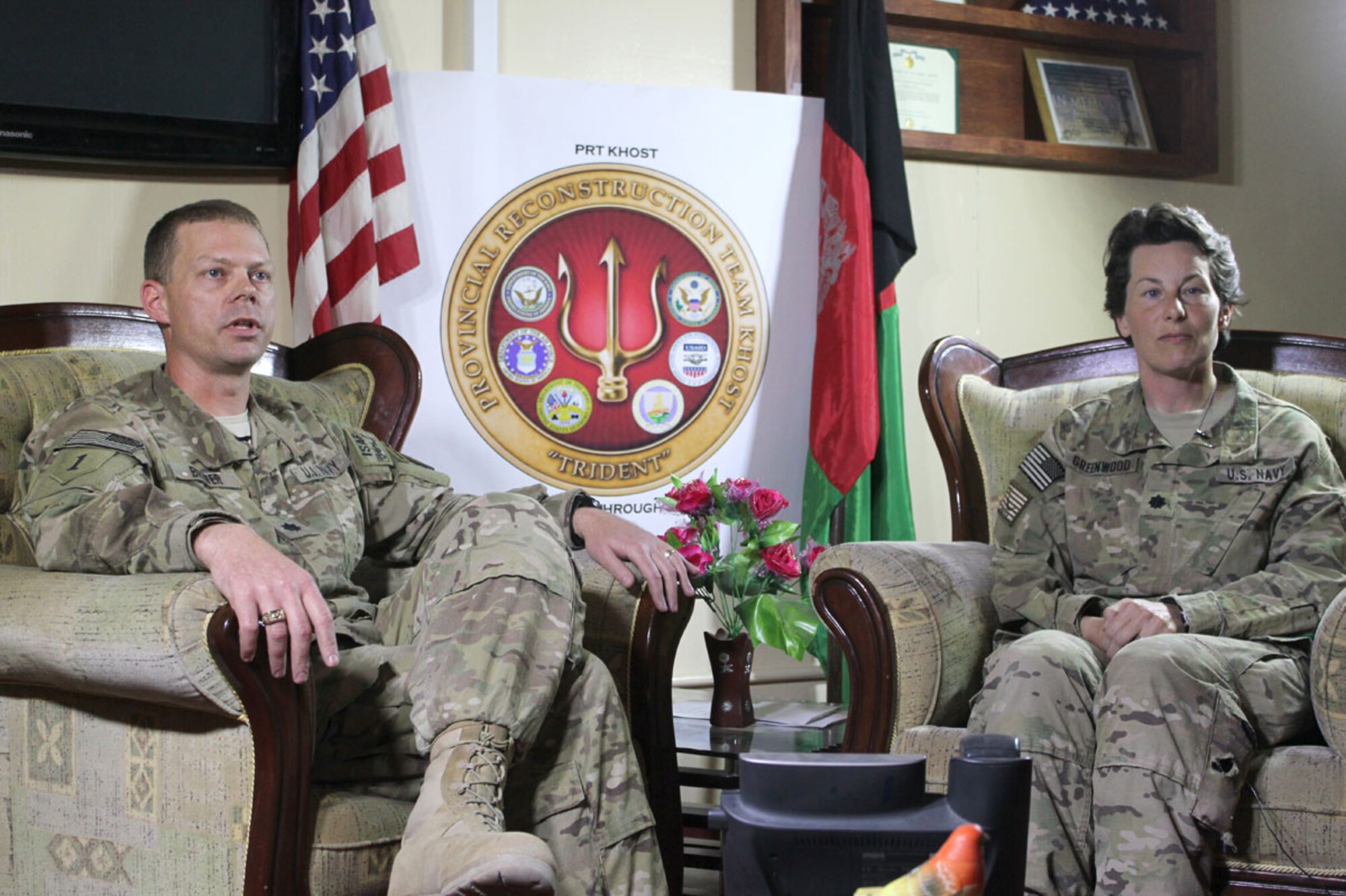 Navy Cmdr. Bradley Brewer, the Provincial Reconstruction Team Khowst commanding officer and Navy Reserve Cmdr. Elizabeth Greenwood, PRT-Khowst executive officer, discuss with reporters the PRT mission in Afghanistan during a press conference at Forward Operating Base Salerno, Afghanistan, Jan. 27. (U.S. Army photo/Pfc. Erin Dierschow)