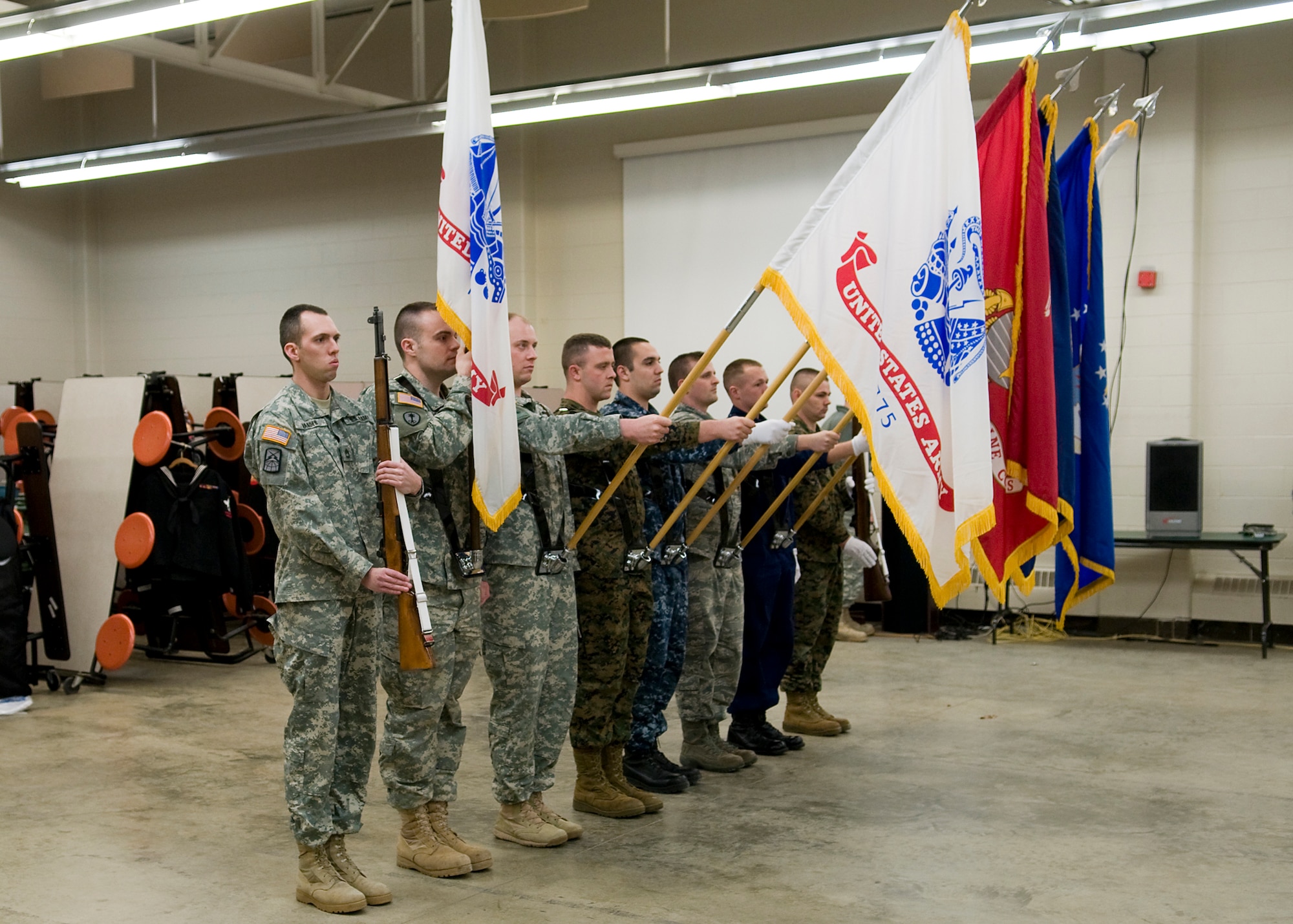 INDIANAPOLIS -- A joint color guard made of servicemembers from around Indiana practice presenting the Colors at the U.S. Army Reserve Center in Indianapolis Jan. 25. The group will present the Colors at Super Bowl XLVI Feb. 5. Pictured from left to right are Sgt. 1st Class David Warder, Staff Sgt. Austin Stoner, Sgt. 1st Class Kyle Rasmussen, Sgt. Brian Francies, Petty Officer 3rd Class Daniel Delgado, Tech. Sgt. Mark Orders-Woempner, Seaman Aaron Such and Sgt. Joshua Bishop. (U.S. Air Force photo/Master Sgt. Geoff Spaulding)
