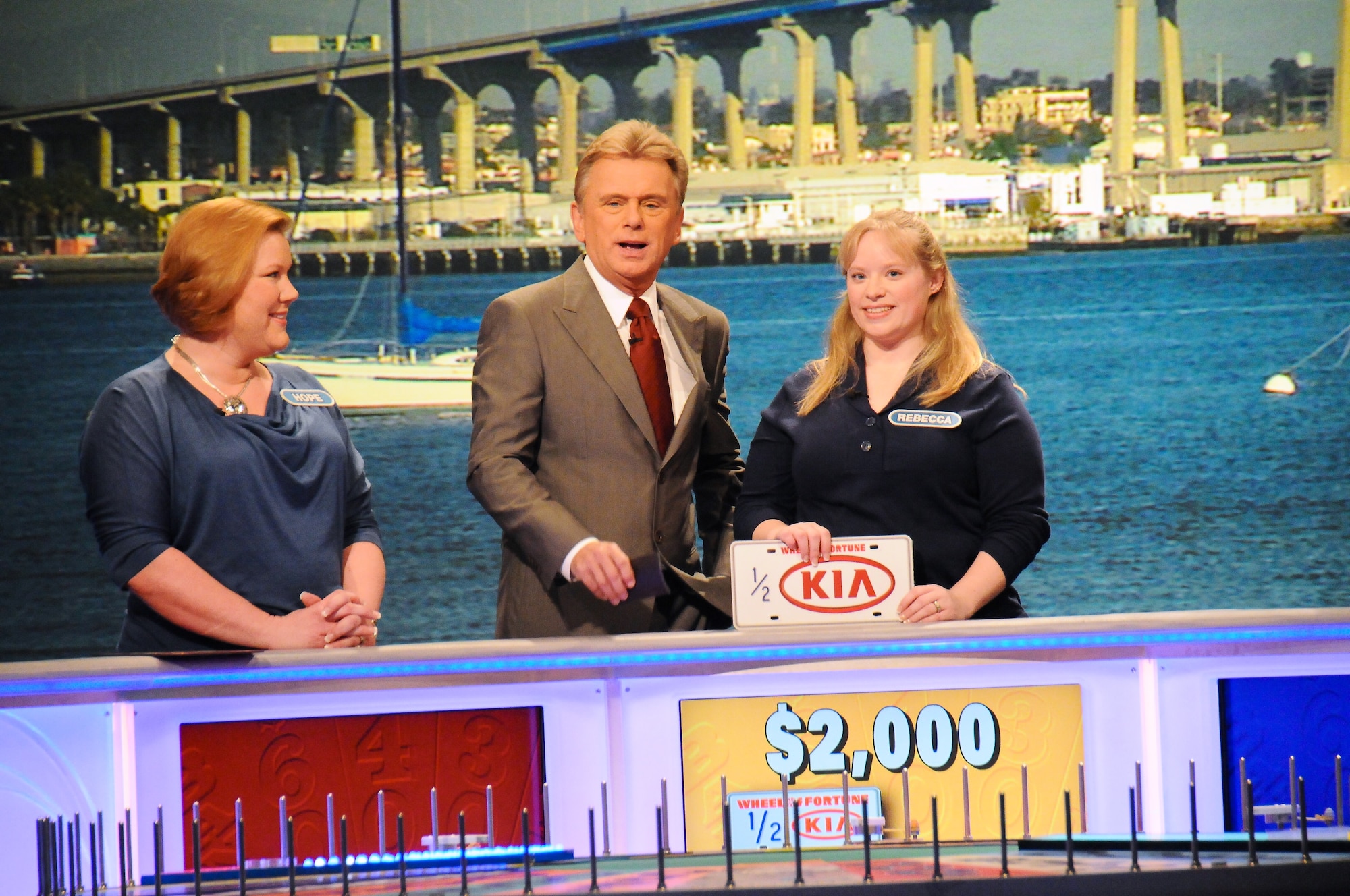 Rebecca Sander, center, wife of Tech. Sgt. Jeffrey Sander, and Hope Mazzeo, left, a Marine spouse, joined military spouses from all branches of service to particpate on Wheel of Fortune for Military Spouses Week, at Sony Studios in Culver City, Calif., Jan 12, 2012. This was the first time the game show highlighted military spouses; the show aired Feb. 6, 2012 (U.S. Air Force photo by Joseph, Juarez/RELEASED)
