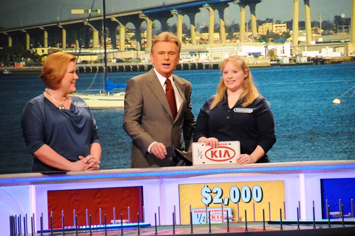 Rebecca Sander, center, wife of Tech. Sgt. Jeffrey Sander, and Hope Mazzeo, left, a Marine spouse, joined military spouses from all branches of service to particpate on Wheel of Fortune for Military Spouses Week, at Sony Studios in Culver City, Calif., Jan 12, 2012. This was the first time the game show highlighted military spouses; the show aired Feb. 6, 2012 (U.S. Air Force photo by Joseph, Juarez/RELEASED)

