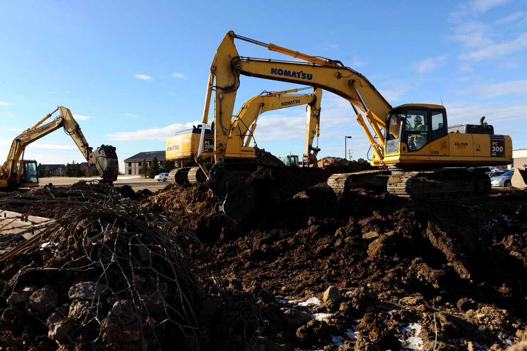 Civilian contractors from Quinn Construction use excavators to install an alternative water supply at Ellsworth Air Force Base, S.D., Jan. 13, 2012. The project connects Ellsworth’s water system with that of the city of Box Elder, S.D., to ensure a constant and reliable water source is available to both communities. (U.S. Air Force photo by Airman 1st Class Zachary Hada/Released)