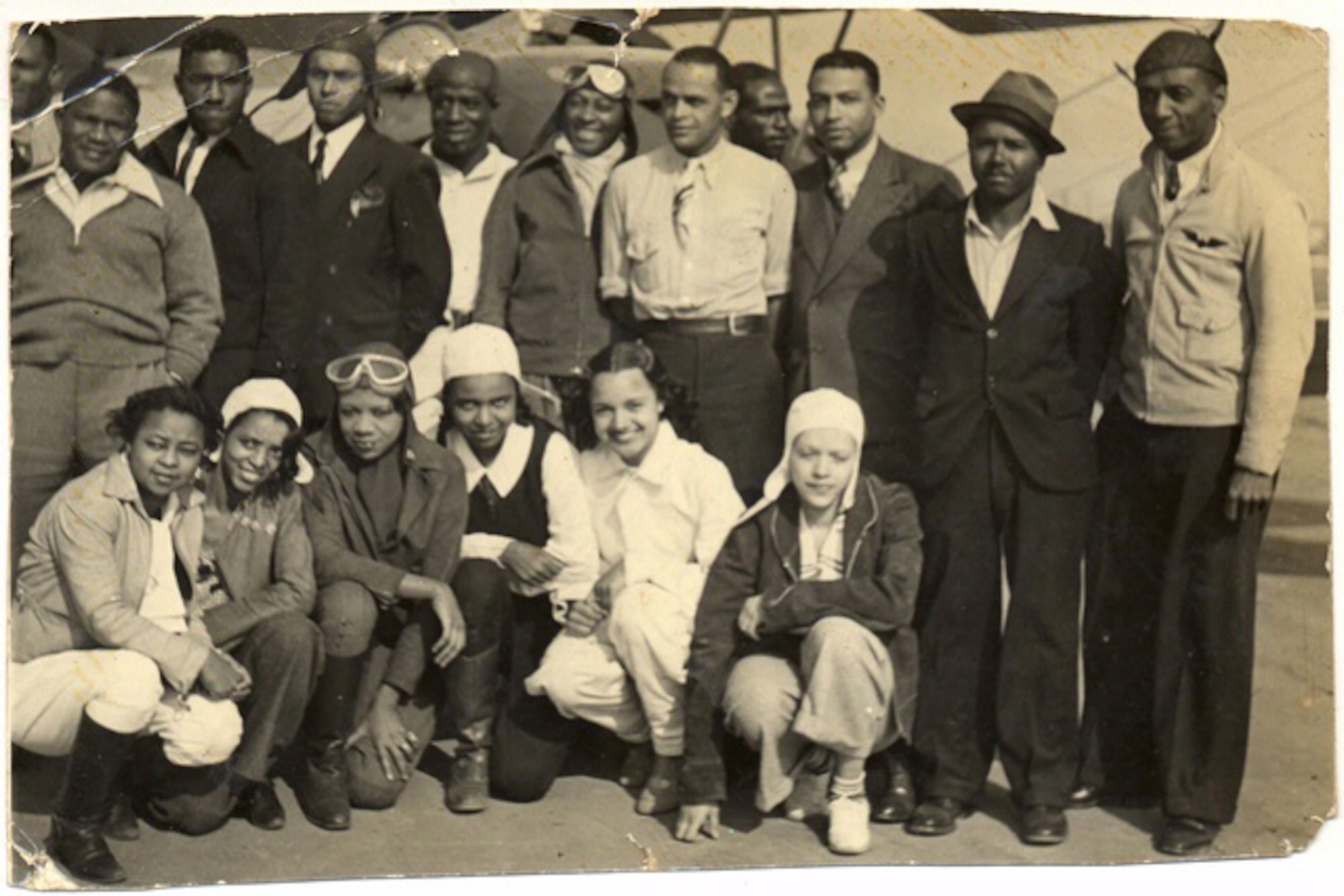 William J. Powell (center) was an aviation entrepeneur who advanced African-American participation in flying.