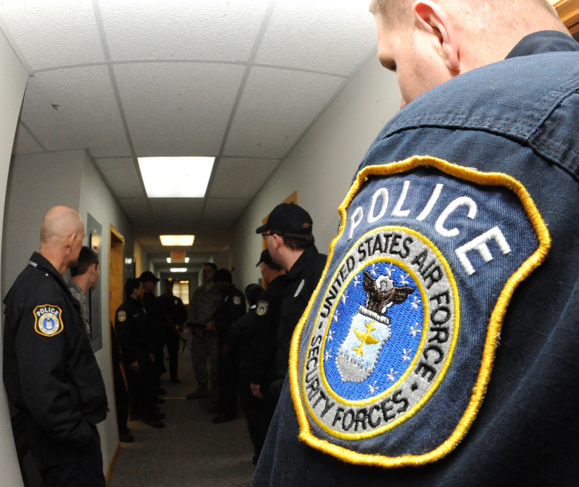 Civilian police officers of the 319th Security Forces Squadron assemble during an exercise on Grand Forks Air Force Base, N.D., Jan. 24, 2012, The officers work to complete their 2012 annual training requirements which include lethal, non-lethal, self aid buddy care, cardiopulmonary resuscitation and more during a two week time frame. (U.S. Air Force photo by Airman 1st Class Xavier Navarro)