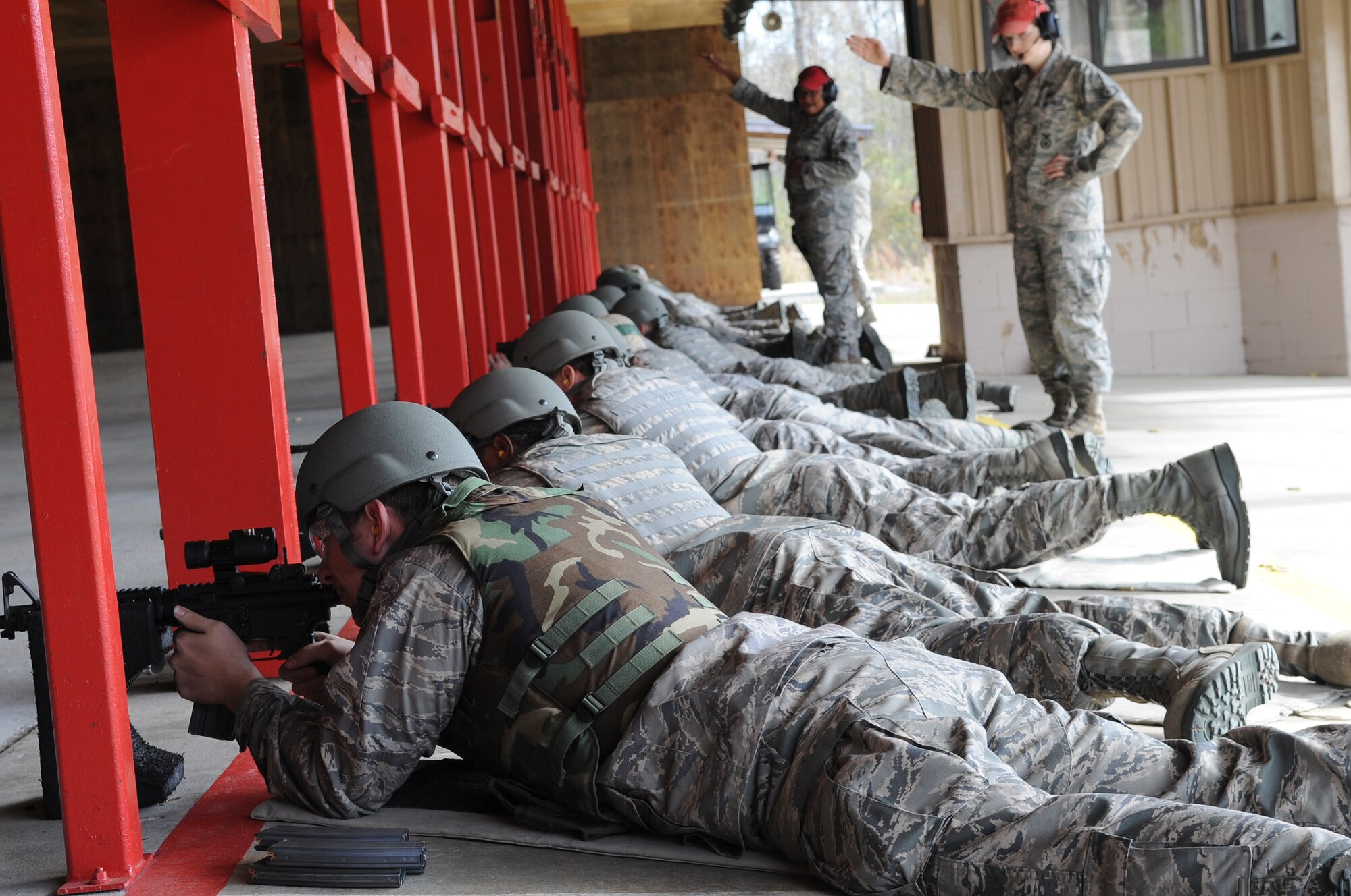 Students of a Combat Arms Training and Maintenance class aim at targets during a qualification round at Moody Air Force Base, Ga., Feb. 1, 2012. Students must partake and pass the CATM class before they deploy. (U.S. Air Force photo by Airman 1st Class Olivia Dominique/Released)
