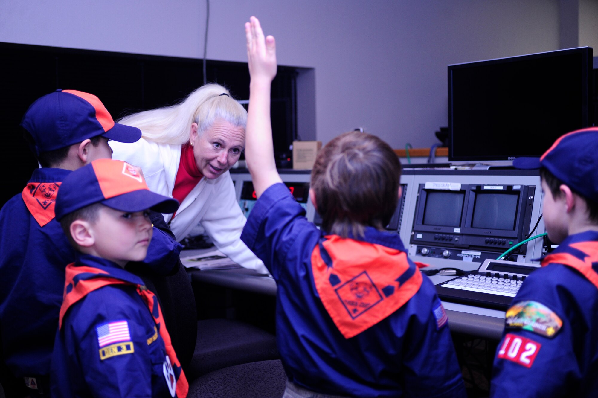 VANDENBERG AIR FORCE BASE, Calif. -- Jan Jones, a 30th Space Wing Public Affairs broadcasting producer, teaches Vandenberg Cub Scout Pack 102 about live broadcasts in the television control room during their visit to the PA office here Wednesday, Feb. 1, 2012. Jones demonstrated how a broadcast is performed during launch operations. (U.S. Air Force photo/Staff Sgt. Andrew Satran) 
