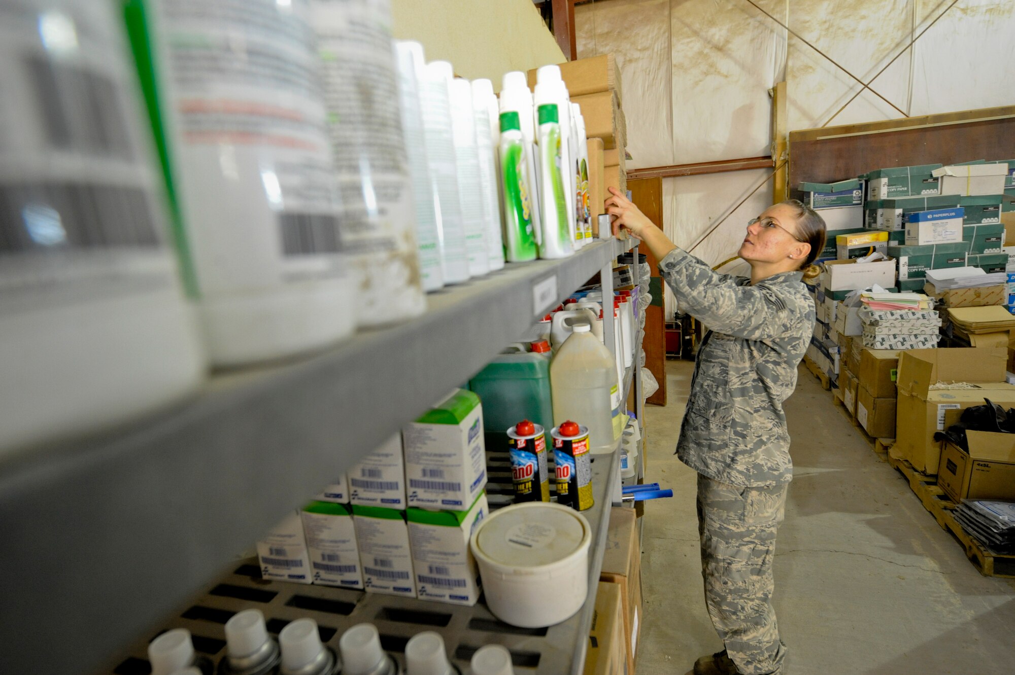 Staff Sgt. Jennifer Endes, 332nd Expeditionary Logistics Readiness Squadron supply flight, restocks the Blanket Purchase Agreement area. BPA items can be obtained by unit representatives upon request by squadron members. Endes is deployed from Joint Base Langley-Eustis, Va., and is a native of Dallas Fort Worth, Texas. (U.S. Air Force photo by Staff Sgt. Joshua J. Garcia/Released)