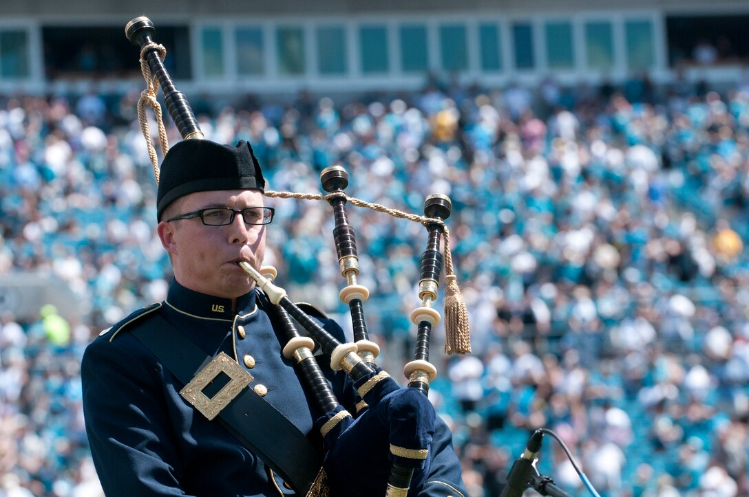 Staff Sgt. George Black, a member of the 125th Fighter Wing, Florida Air National Guard and the Air Force Reserve Pipe Band performs Amazing Grace during the halftime ceremony at the Jacksonville Jaguars season home opener on September 11, 2001. (USAF Photo By TSgt Jaclyn Carver)