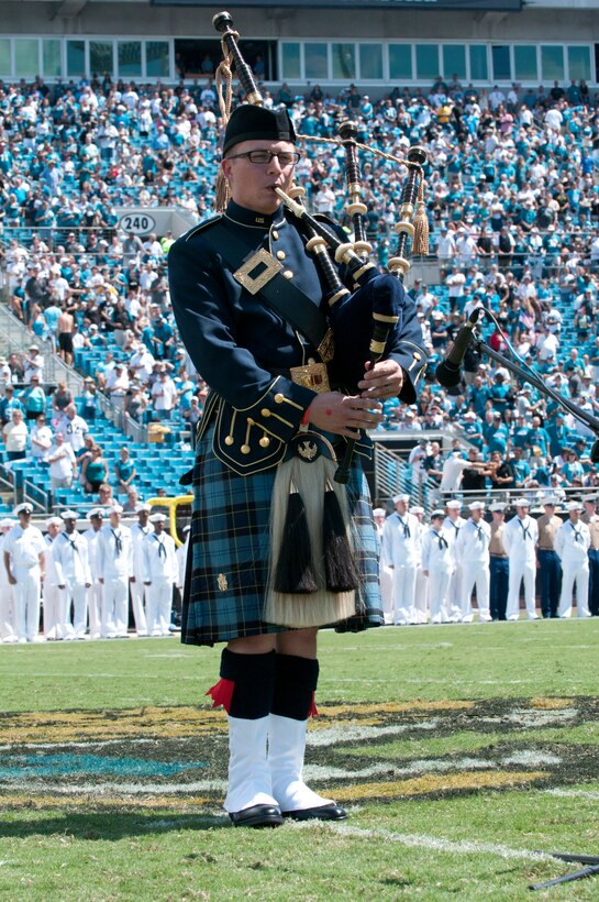 Staff Sgt. George Black, a member of the 125th Fighter Wing, Florida Air National Guard and the Air Force Reserve Pipe Band performs Amazing Grace during the halftime ceremony at the Jacksonville Jaguars season home opener on September 11, 2001. (USAF Photo By TSgt Jaclyn Carver)