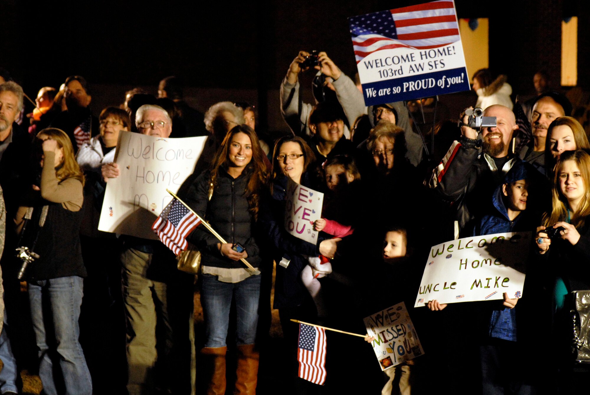 Members of the 103rd Security Forces Squadron receive an enthusiastic welcome home from Afghanistan at Bradley Air National Guard Base, East Granby, Conn., Jan. 30, 2012. The troops performed security and patrol operations at Bagram Airfield during their six-month deployment. (U.S. Air Force photo by Tech. Sgt. Erin McNamara\RELEASED)