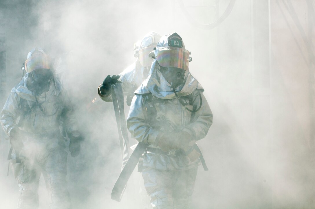 Fire fighters from the 125th Fighter Wing, conduct a structure fire exercise for a Unit Compliance Inspection at Jacksonvile IAP on 22 October 2011. (U.S. Air Force Photo by SSgt Jeremy Brownfield)