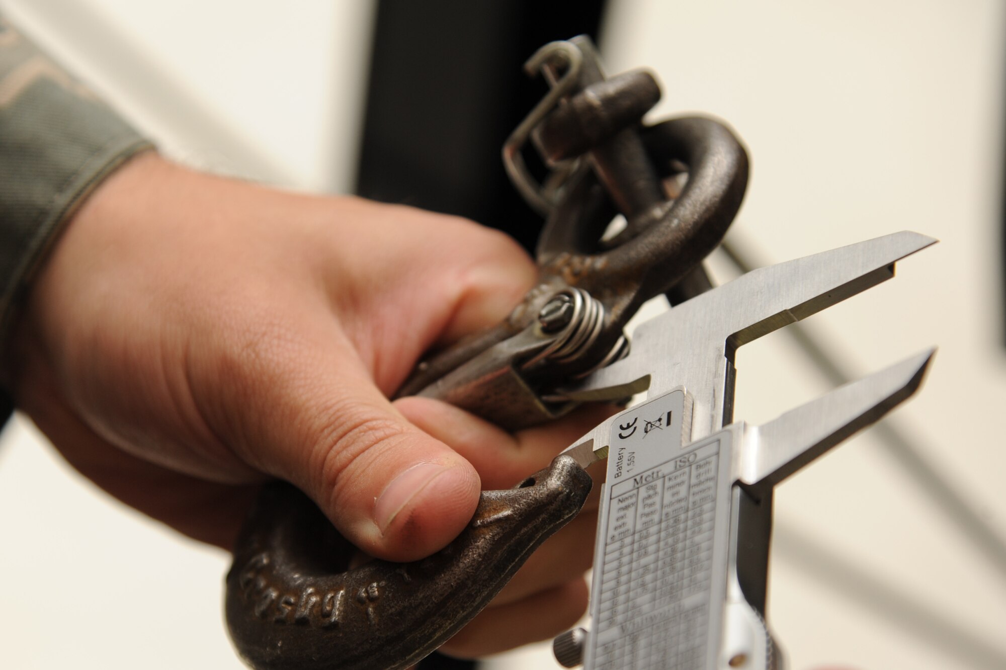 U.S. Air Force Staff Sgt. James Pyatt measures the inside of a hook during an inspection on Seymour Johnson Air Force Base, N.C., Jan. 26, 2012. When a hook measures 15 percent more than the manufacturer’s baseline size it becomes unserviceable. Pyatt is a 4th Component Maintenance Squadron personnel support from Kenosha, Wis. (U.S. Air Force photo/Senior Airman Whitney Stanfield/Released)
